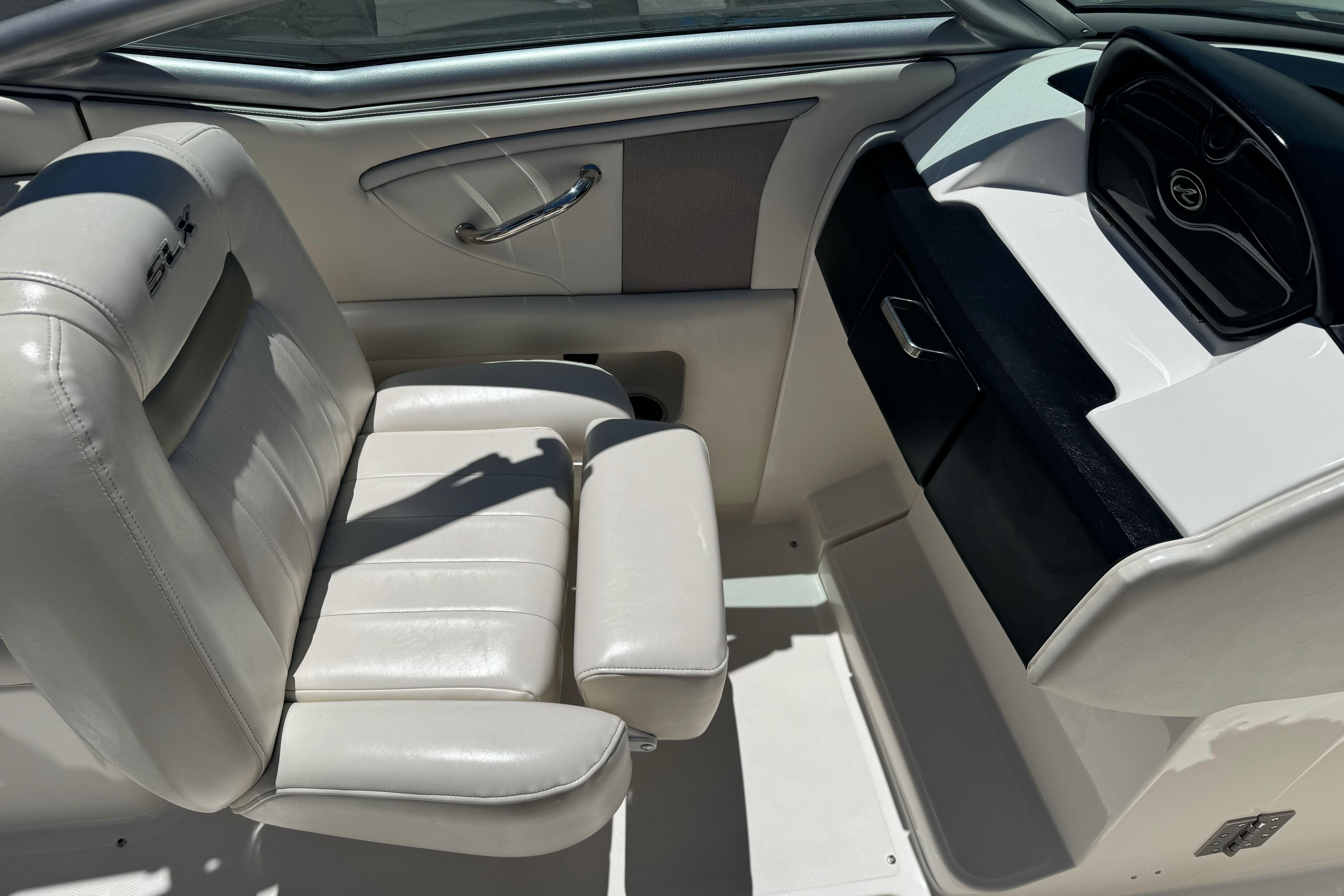 Interior of a 2007 Sea Ray SLX 250 boat with white leather seating.