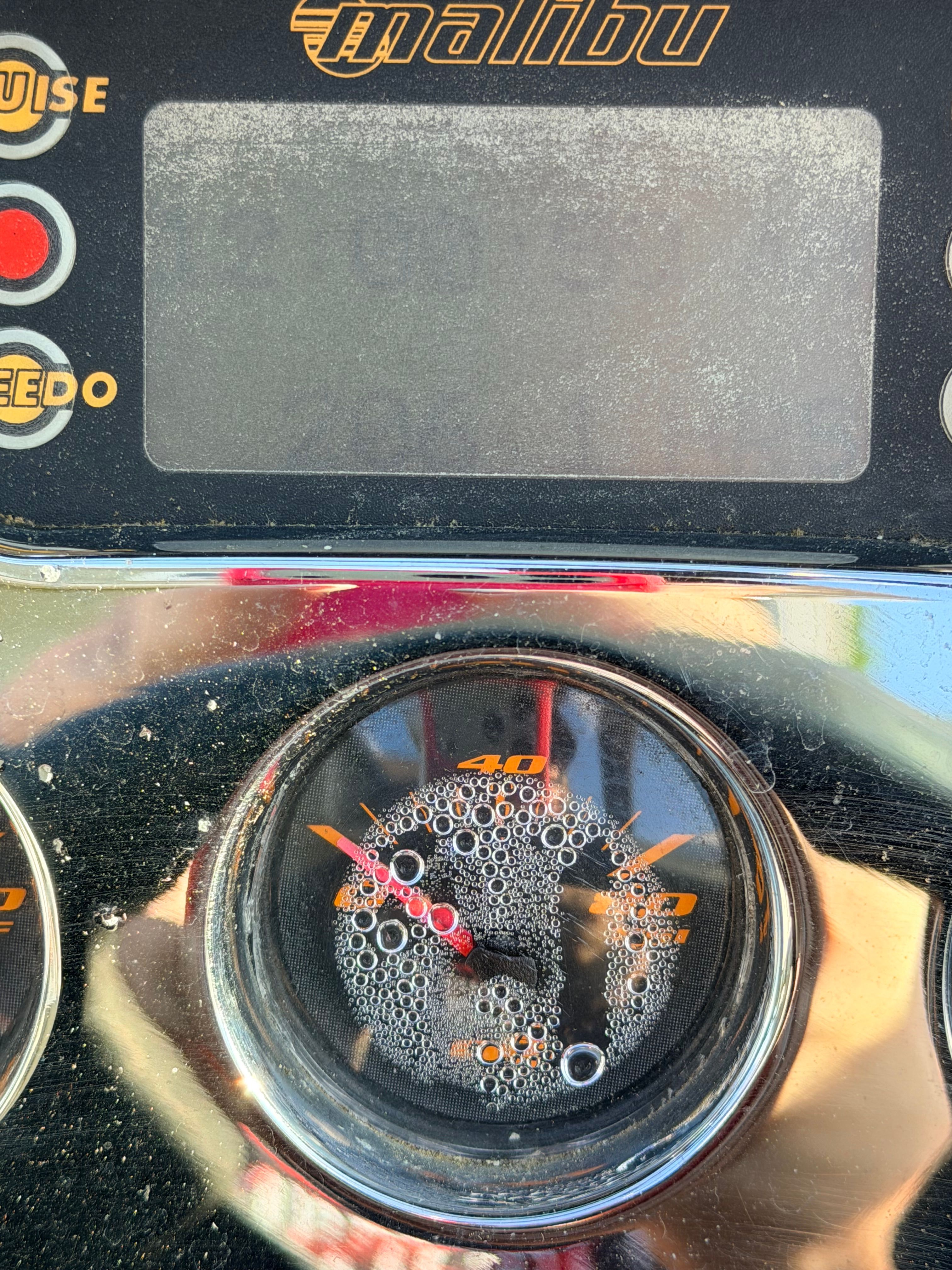 Malibu iRide 2006 dashboard with water droplets.