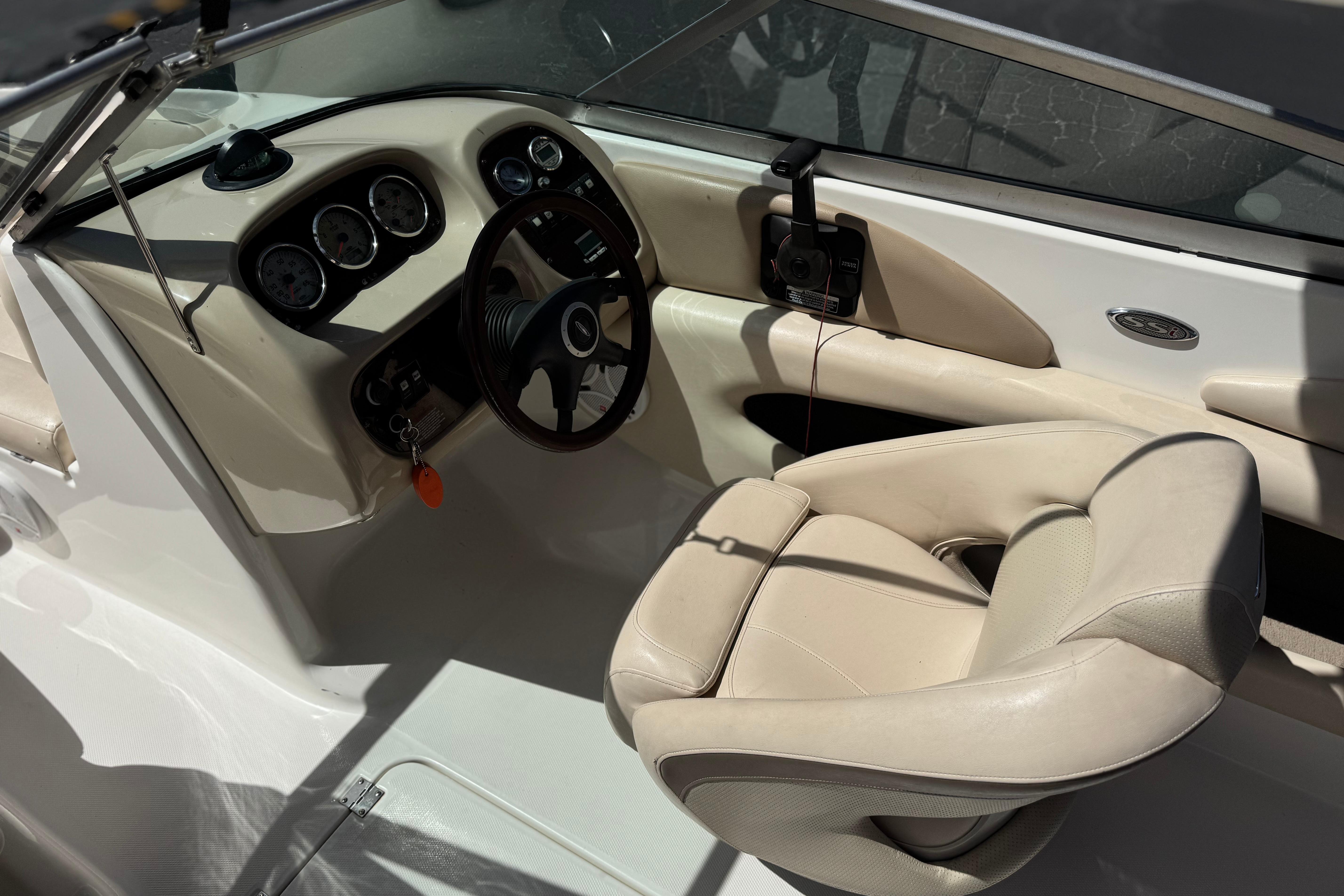 Interior of a 2006 Chaparral 190 SSi boat showing steering wheel and dashboard.
