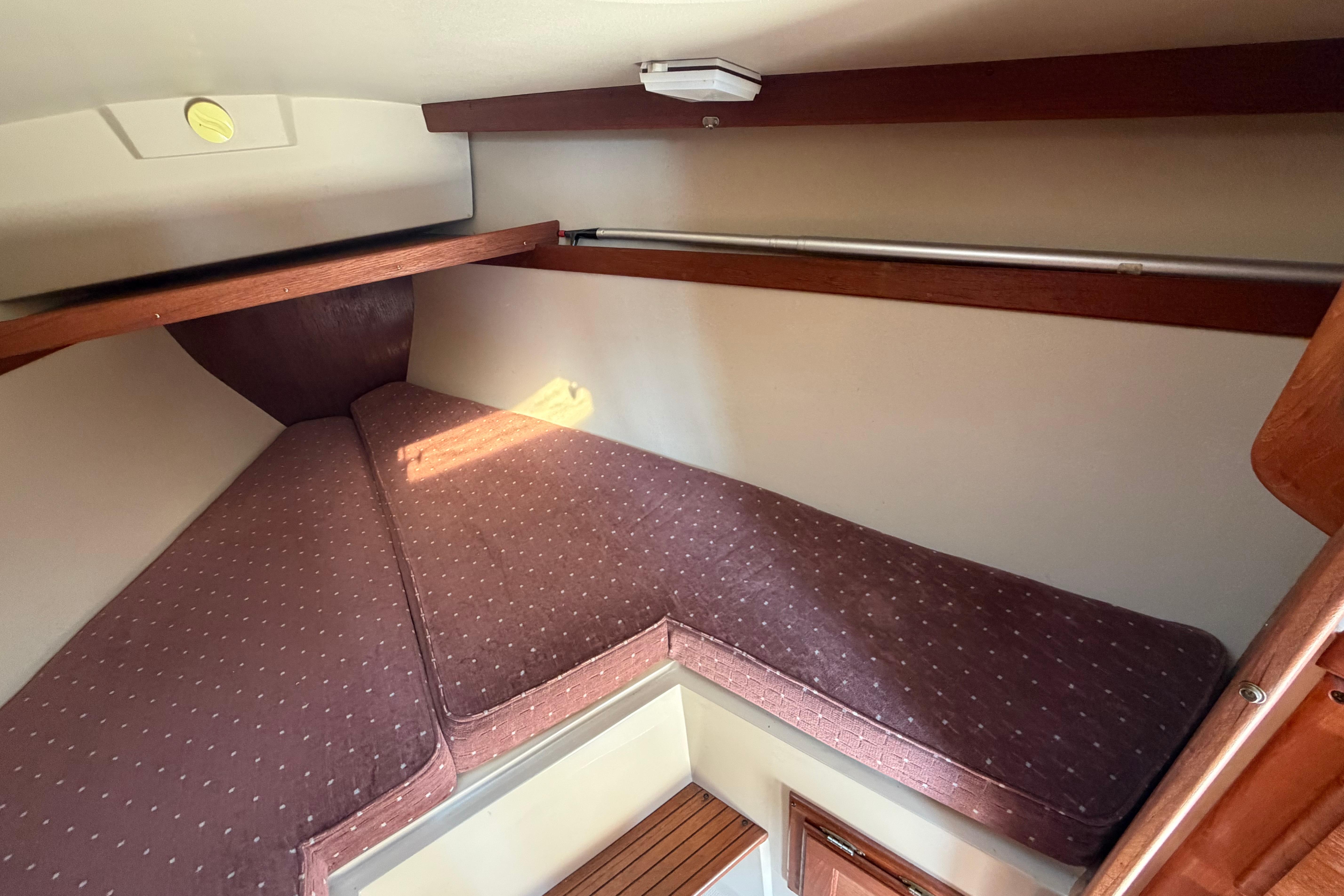Interior cabin of a 1988 Catalina 30 MkII sailboat with cozy V-berth.