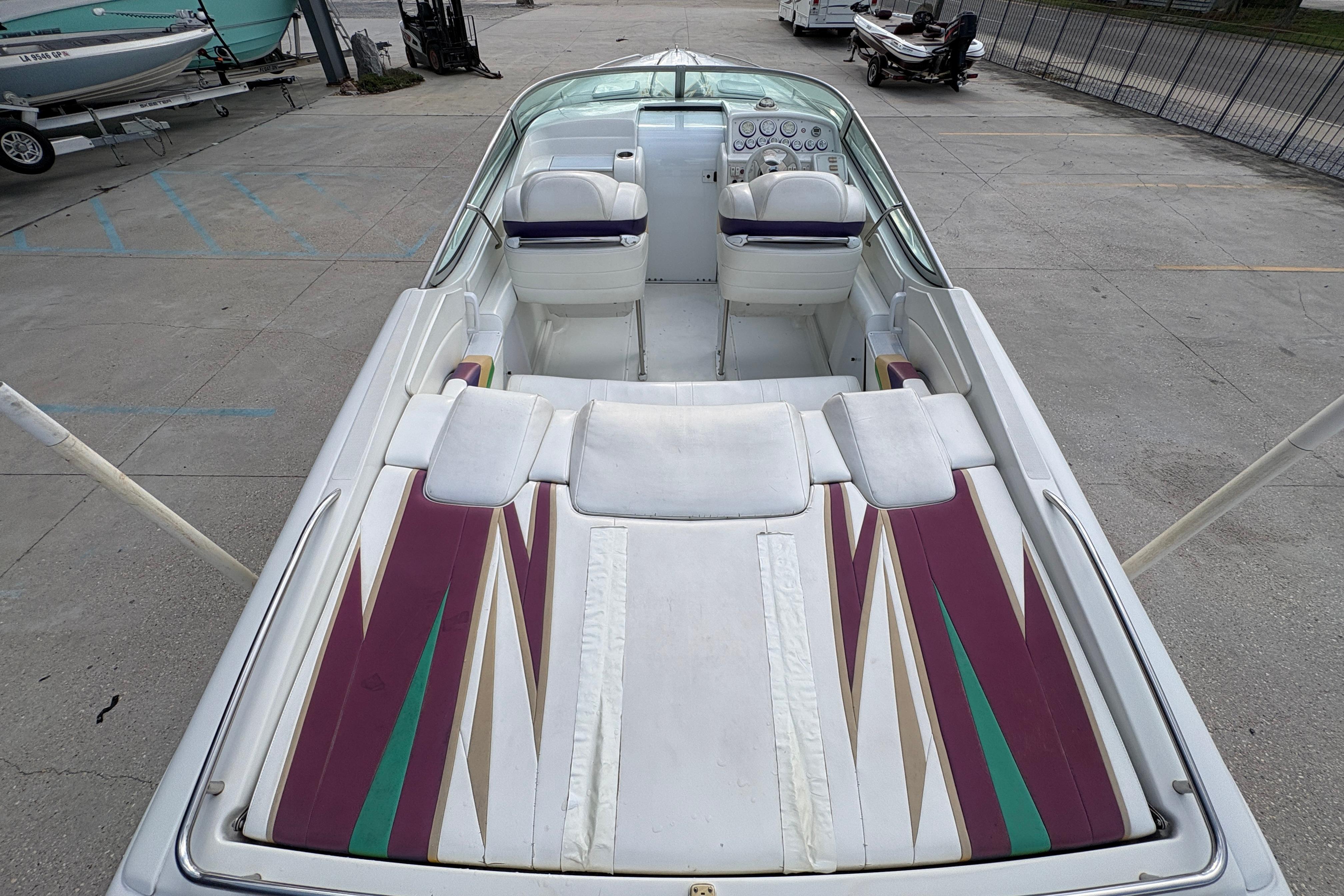 2002 Formula 292 FASTech boat interior with colorful upholstery and dual seating.
