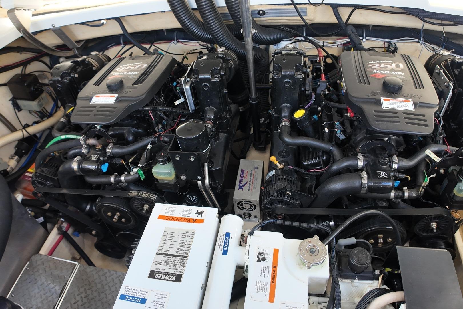 Engine compartment of a 2007 Formula 330 Sun Sport boat, featuring dual MerCruiser engines.