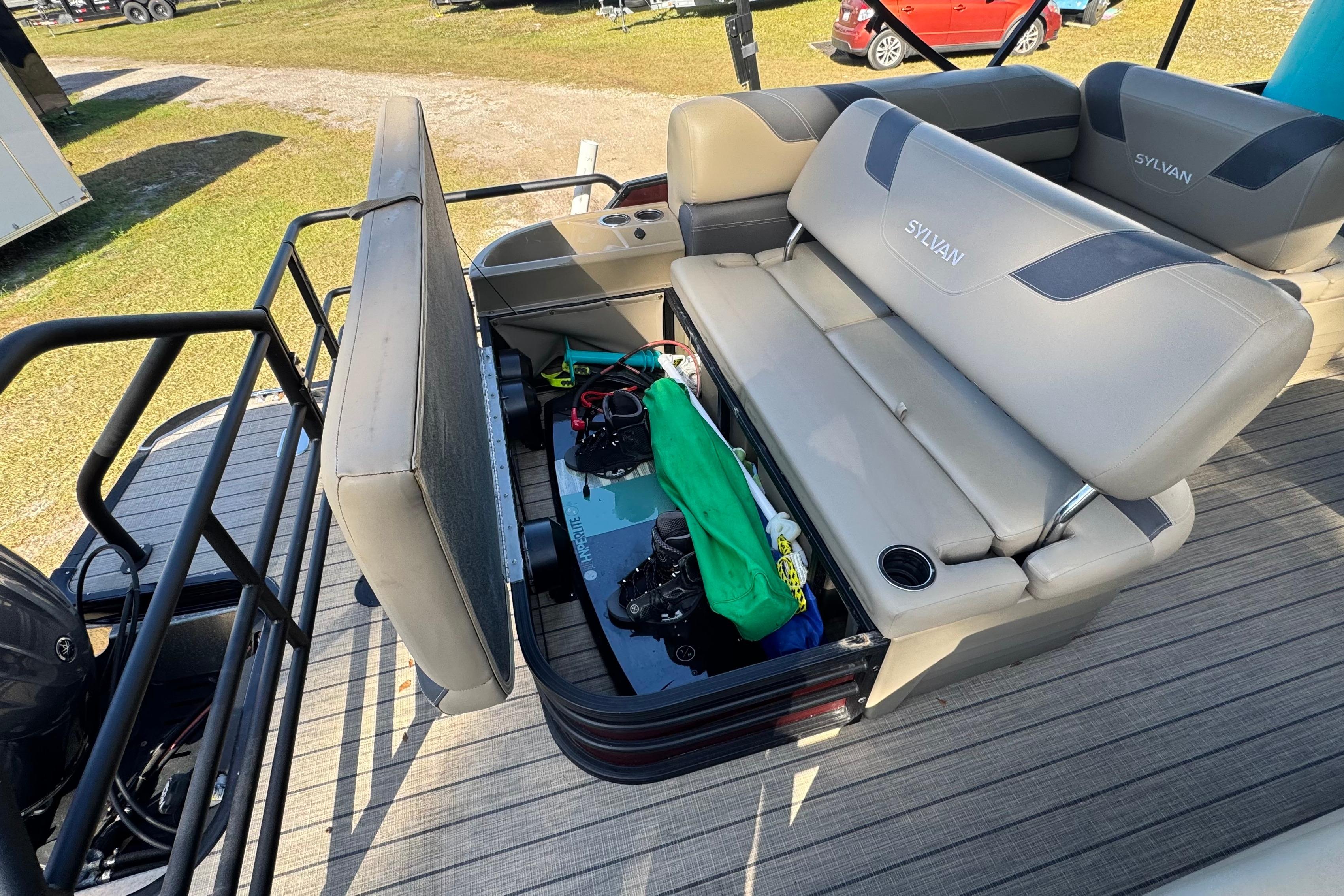 2023 Sylvan L5 CLZ boat with open storage under cushioned seats.