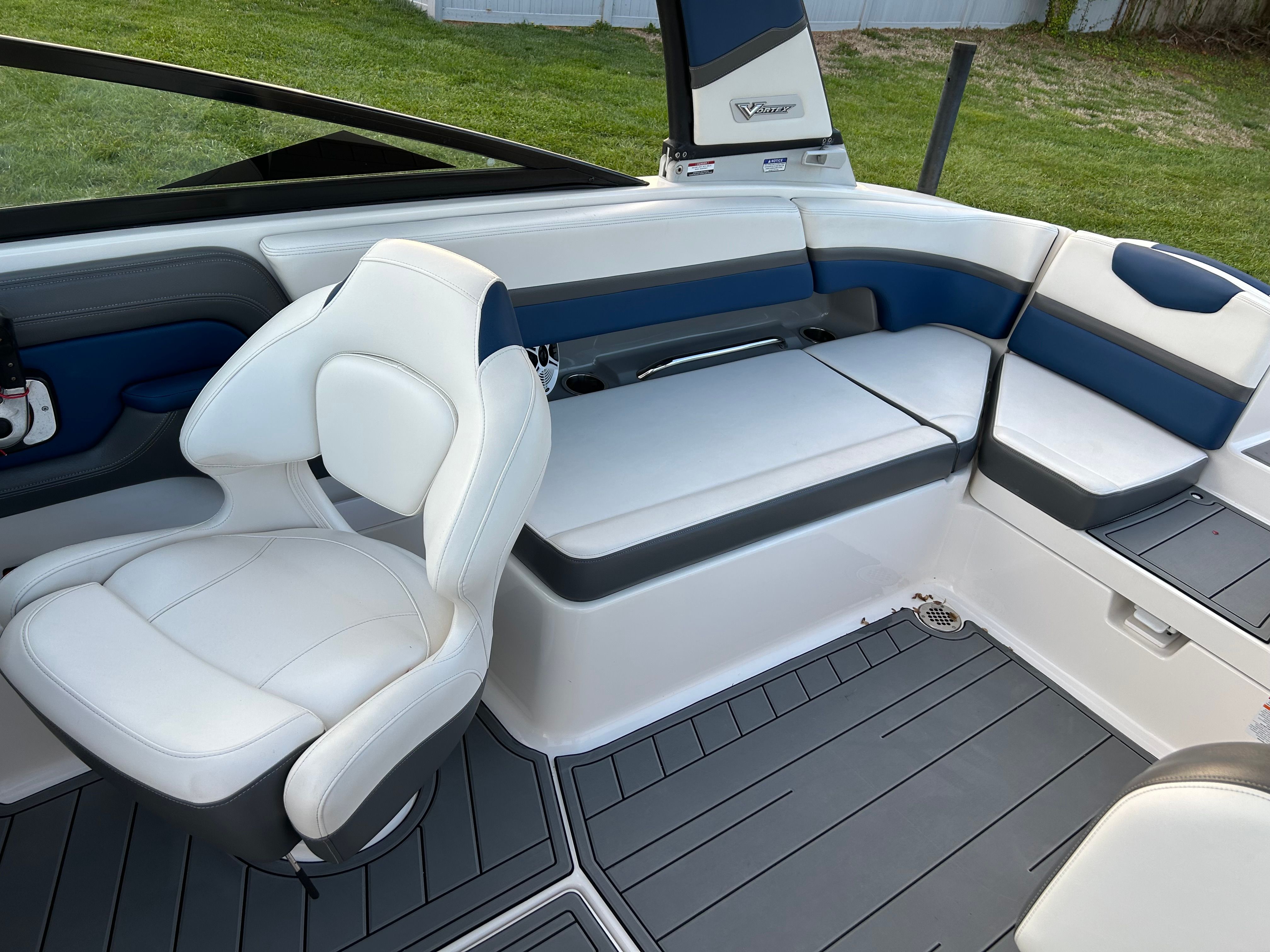 Interior of 2015 Chaparral Vortex 243 VRX with white seating.