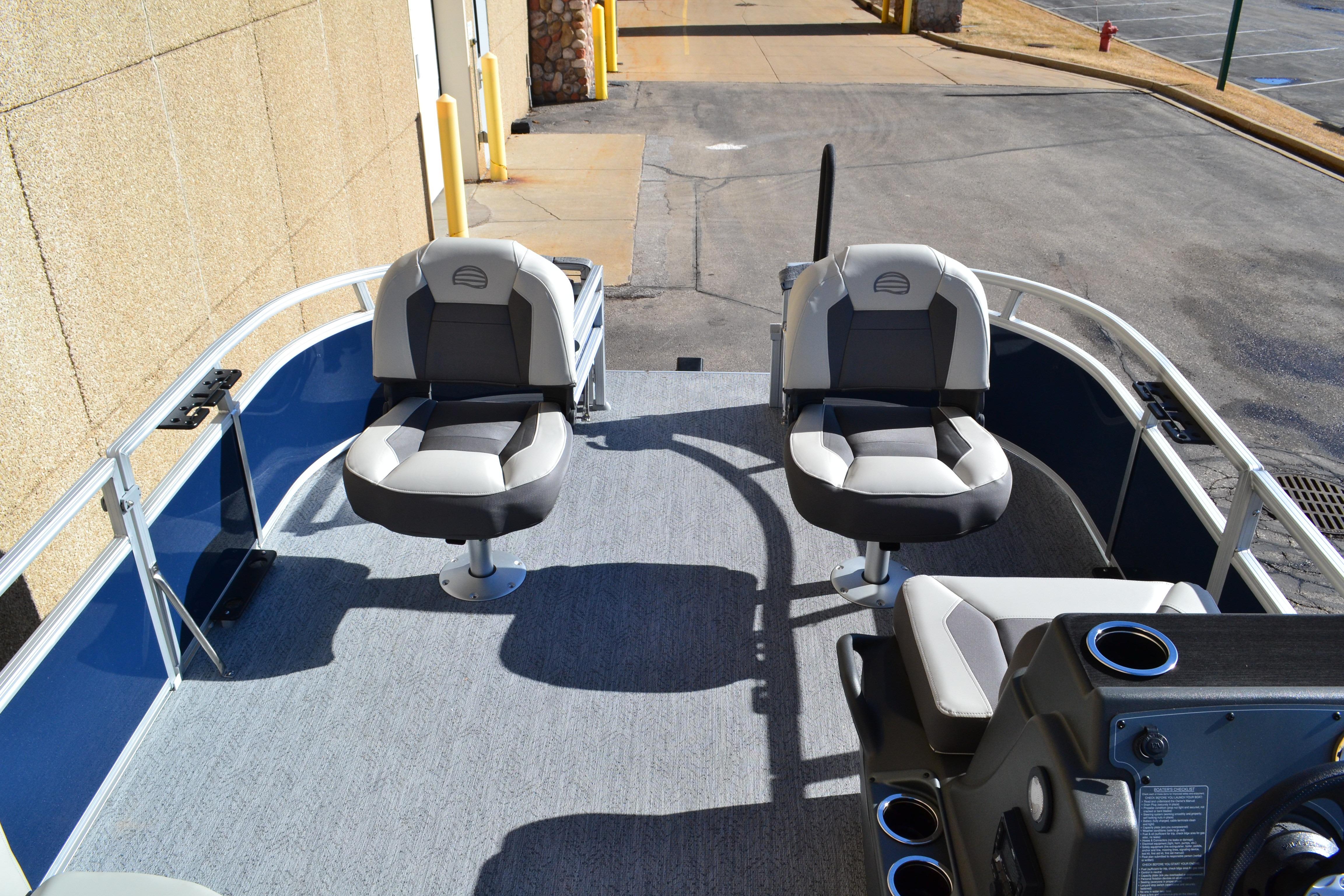 2026 Sun Tracker Bass Buggy 16 XL Select pontoon boat with swivel seats and console.