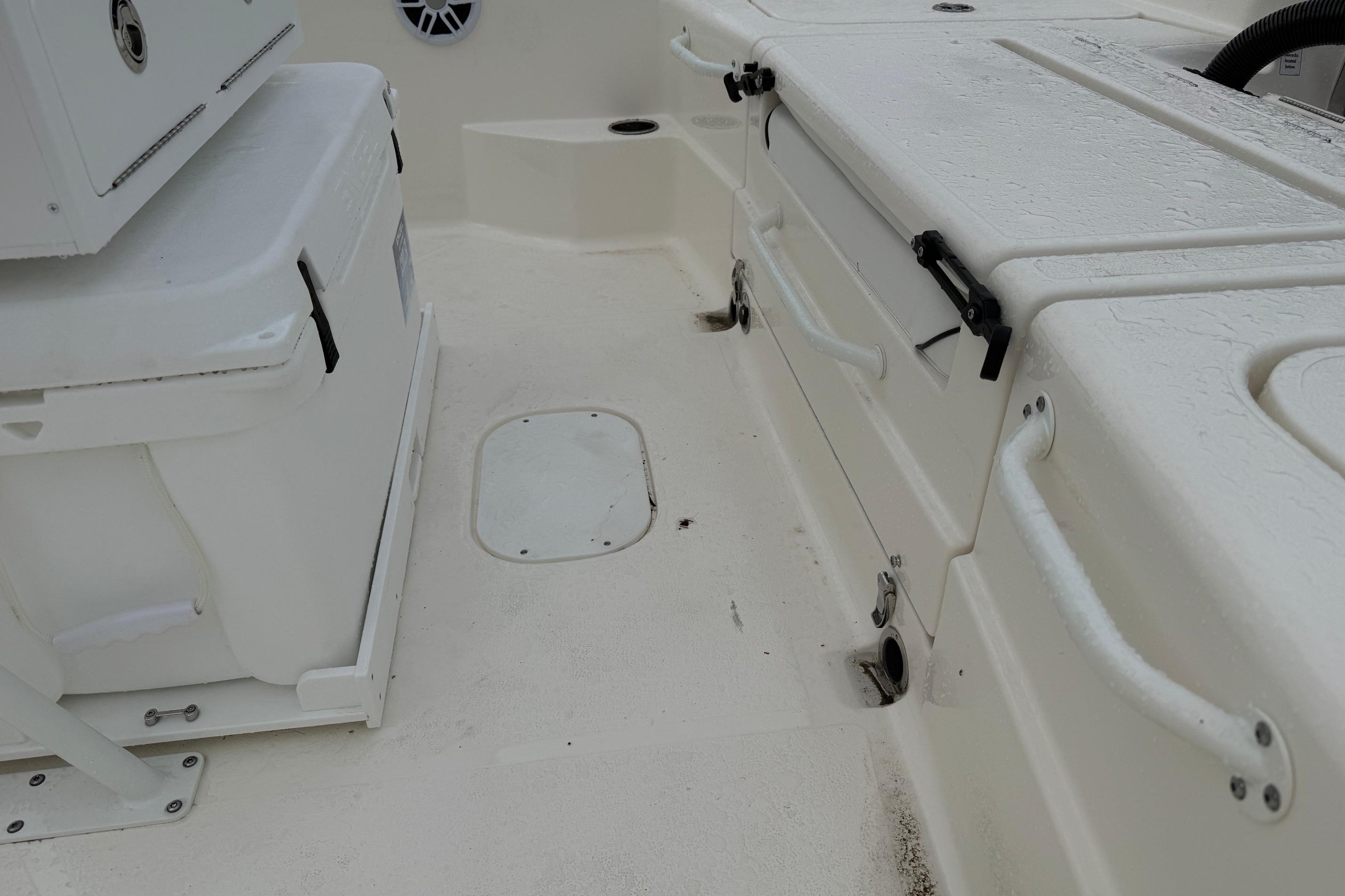 Interior view of a 2026 Skeeter SX2350 boat, featuring storage compartments and seating.