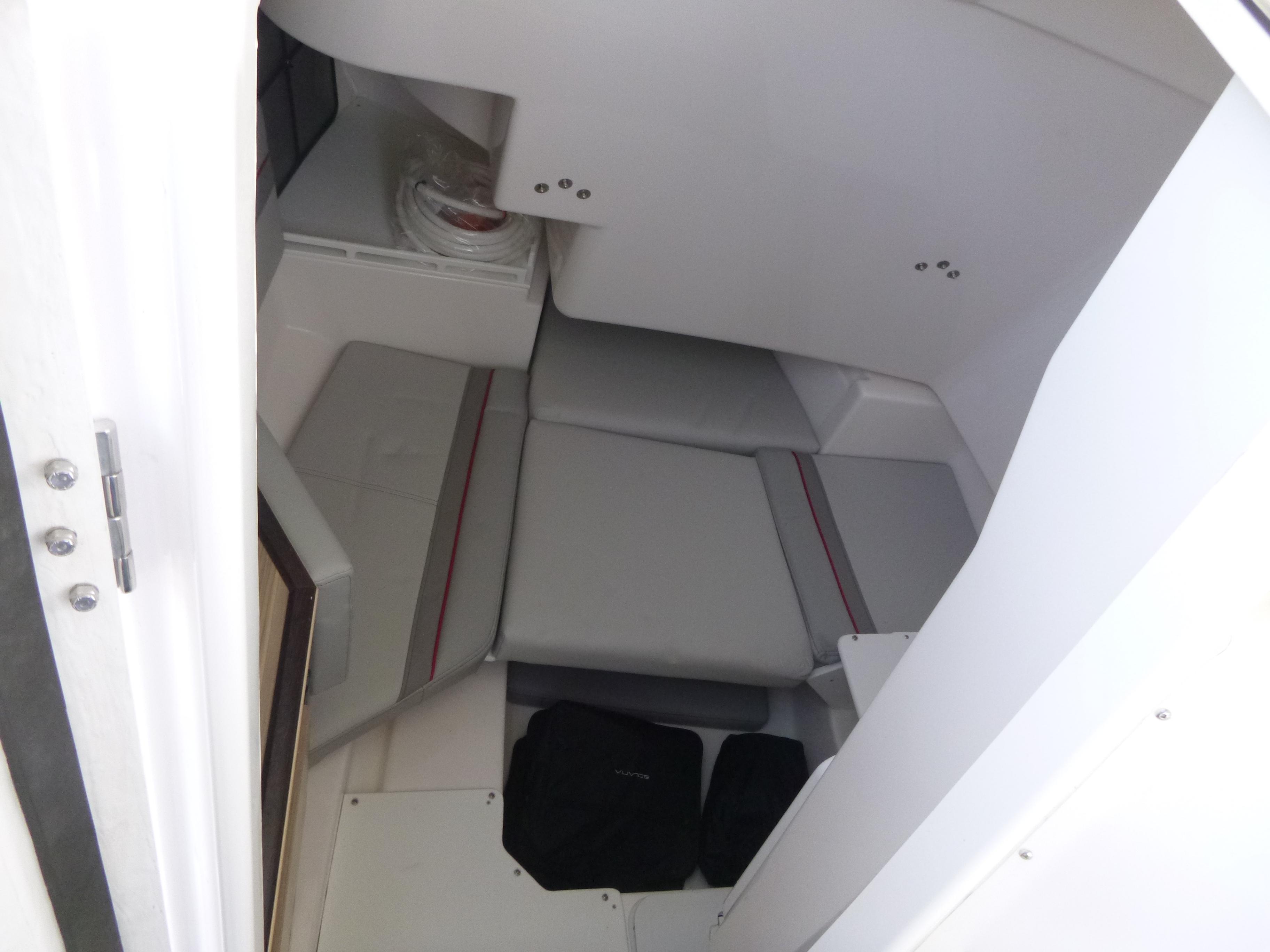 Interior cabin of 2025 Solara S-250 CW boat with gray seating.