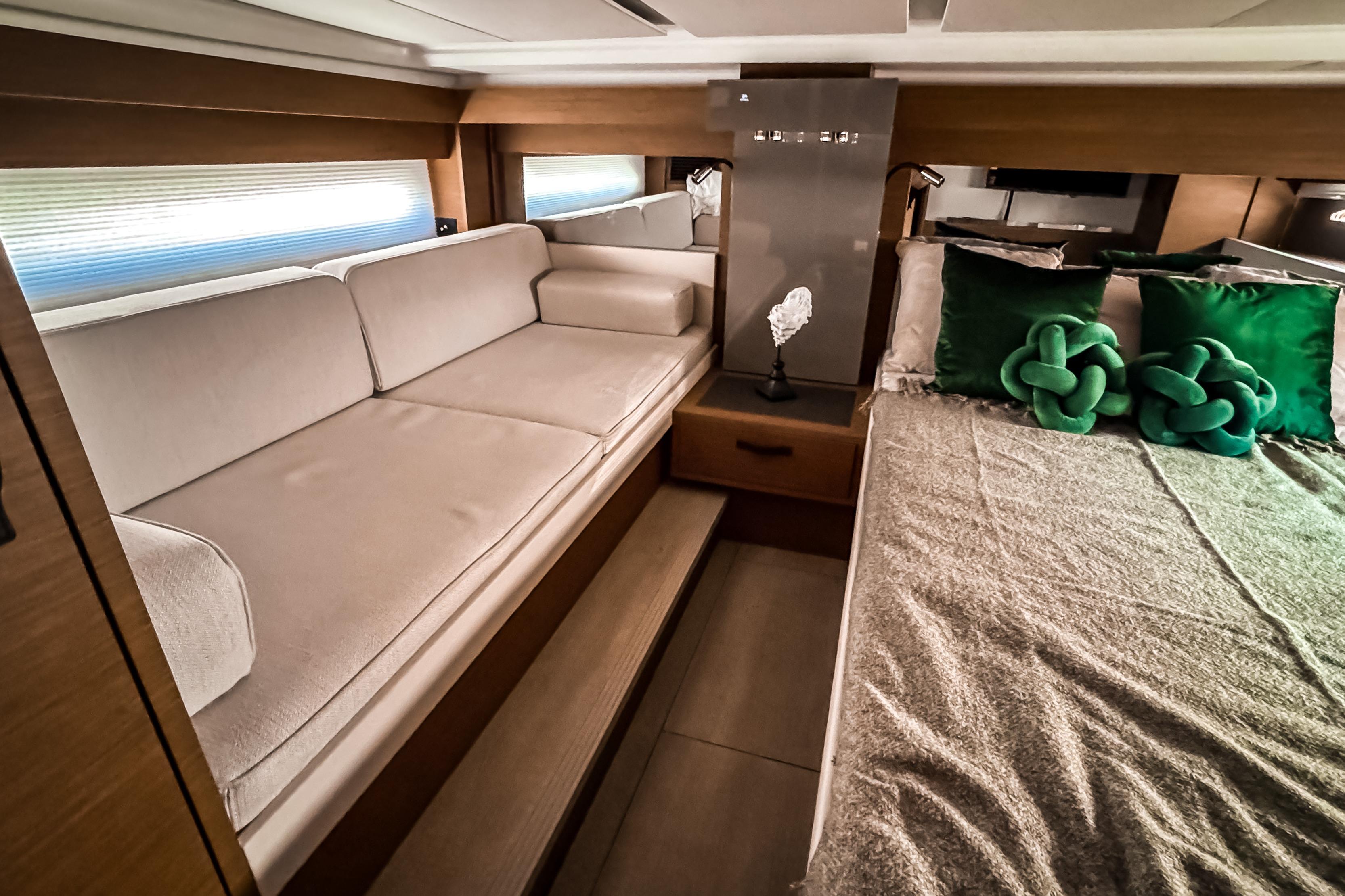 Interior of 2026 Wellcraft 44 Explorer with sofa and bed.
