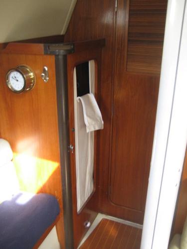 Interior of a C&C Landfall yacht with wooden walls and a barometer.
