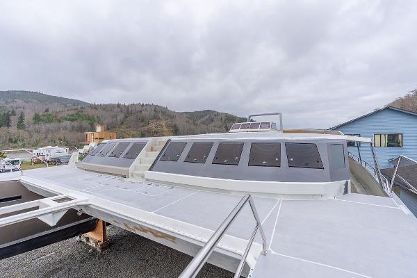 2025 Catamaran Bloomfield 86 Motorsailor on land, showcasing sleek design and large windows.