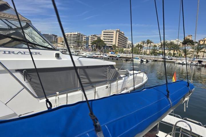 Catalina 28 sailboat docked in marina with cityscape background, 1992 model.