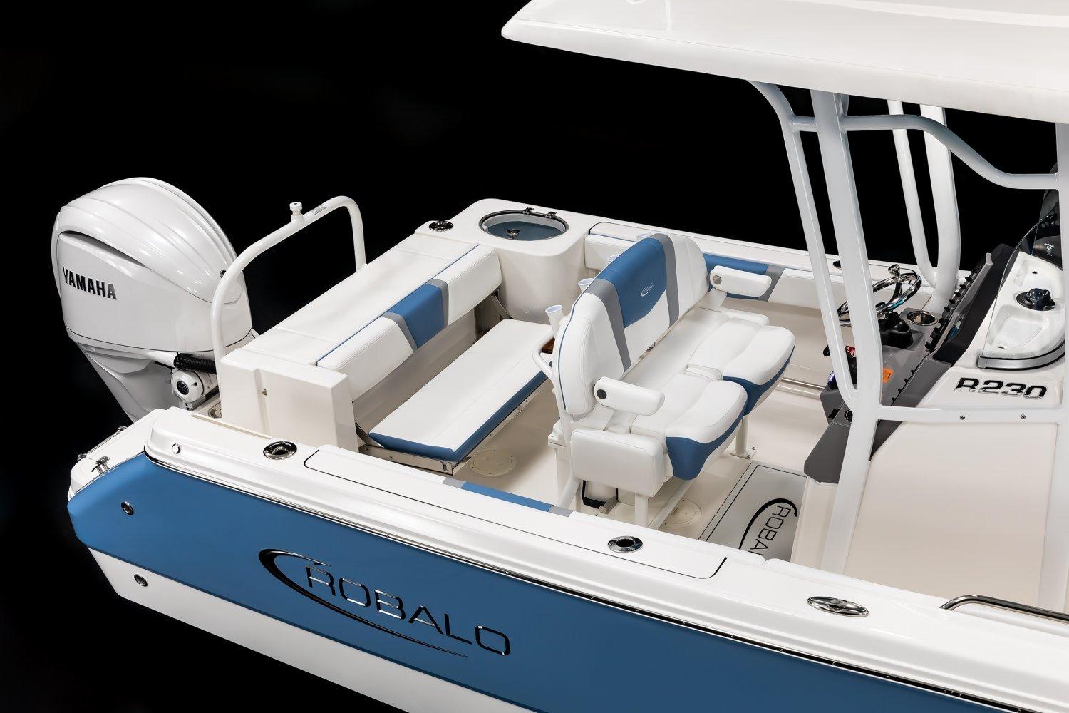 Manufacturer Provided Image: 2026 Robalo R230 Center Console boat with Yamaha engine, featuring blue and white seating.