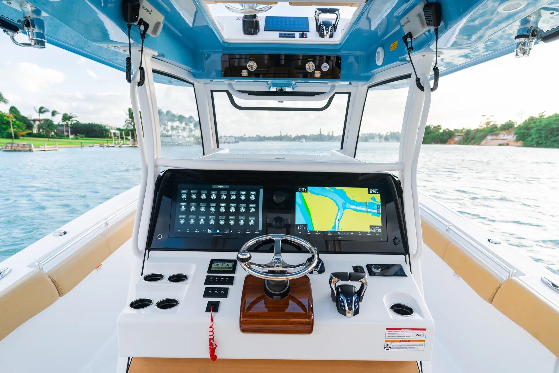 2026 Sportsman Open 352 Center Console boat dashboard with navigation screens on open water.