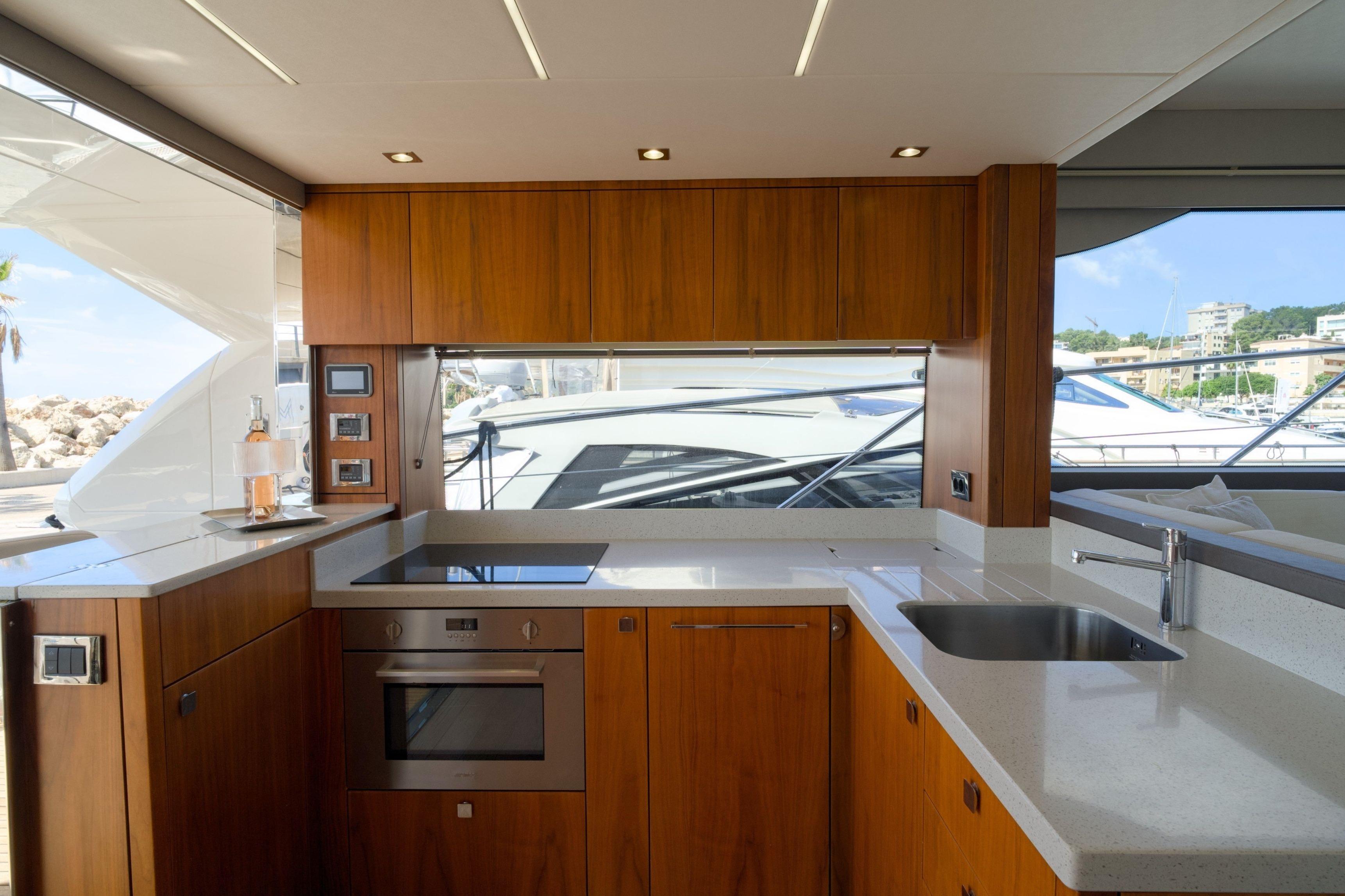 Luxurious kitchen interior of 2019 Sunseeker Manhattan 52 yacht with modern appliances.