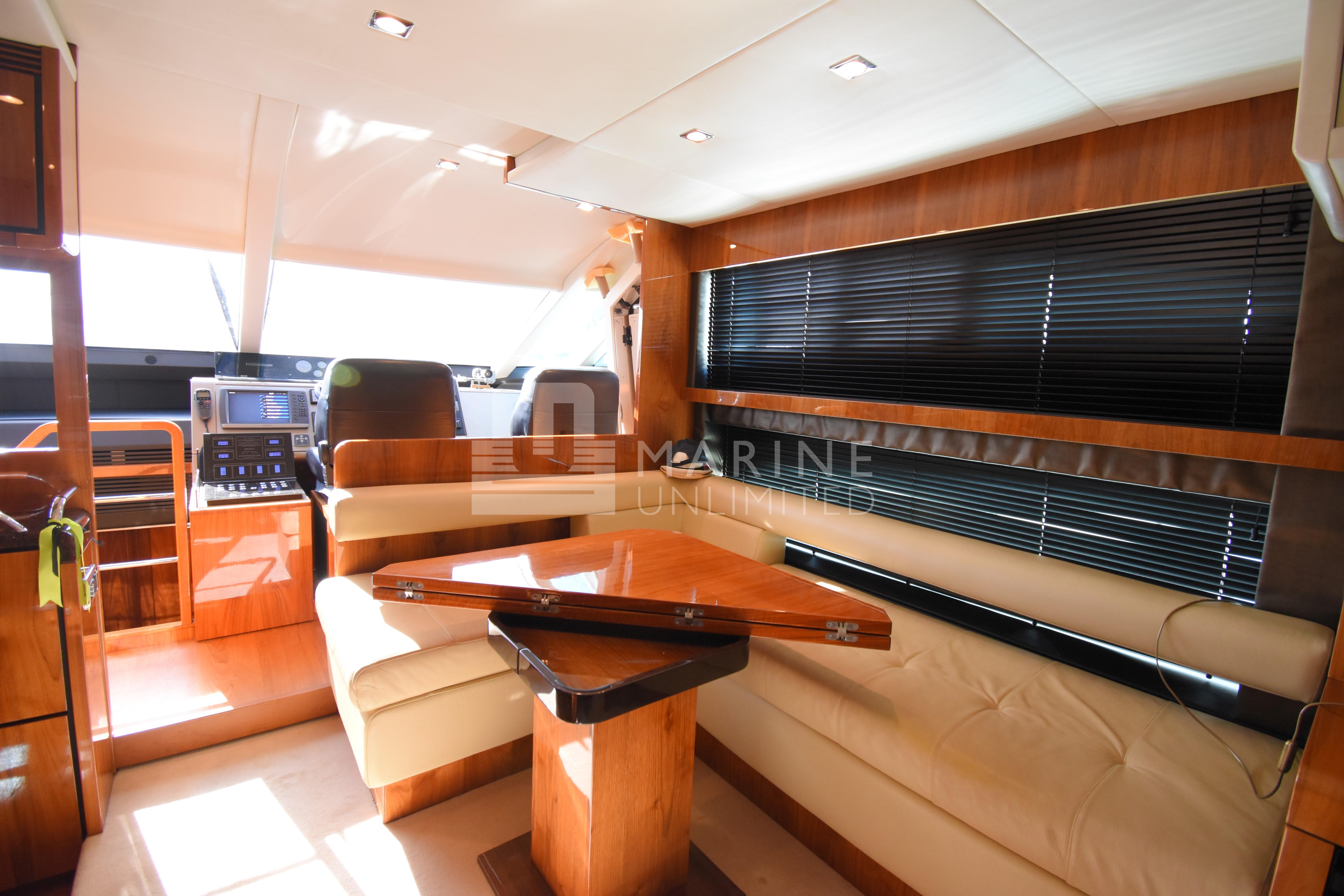 Luxurious interior of 2010 Fairline Squadron 55 yacht with elegant seating and modern design.