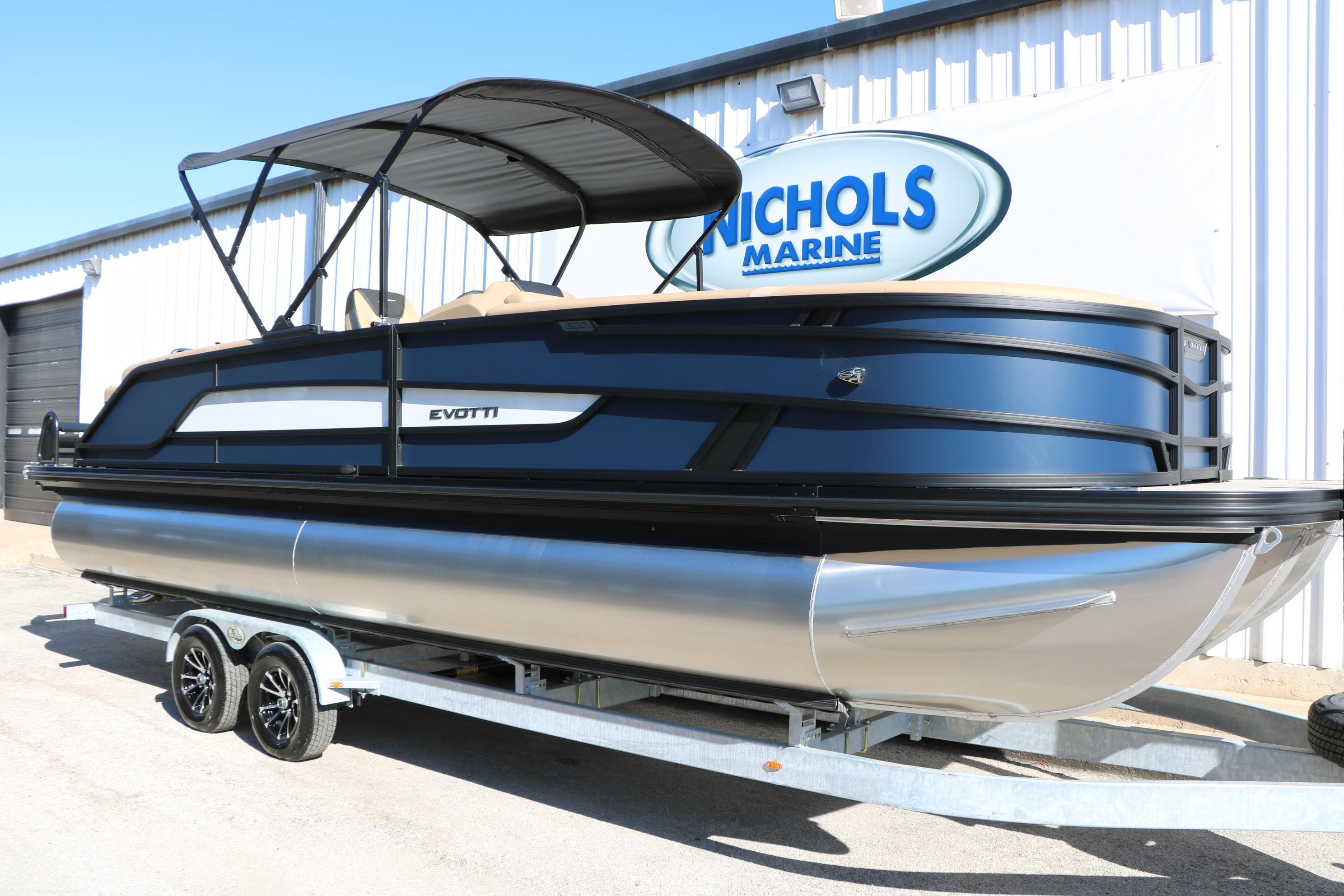 2026 Evotti 525 QL Tri-Toon boat on trailer at Nichols Marine dealership.