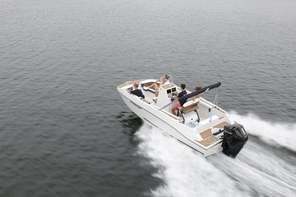 2025 Starcraft SVX 211 OB CC boat cruising on open water.