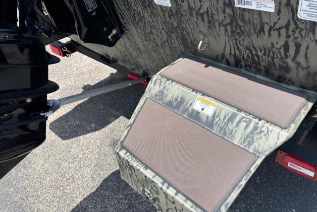 2026 Tracker Grizzly 2072 CC boat with camouflage design and rear step detail.