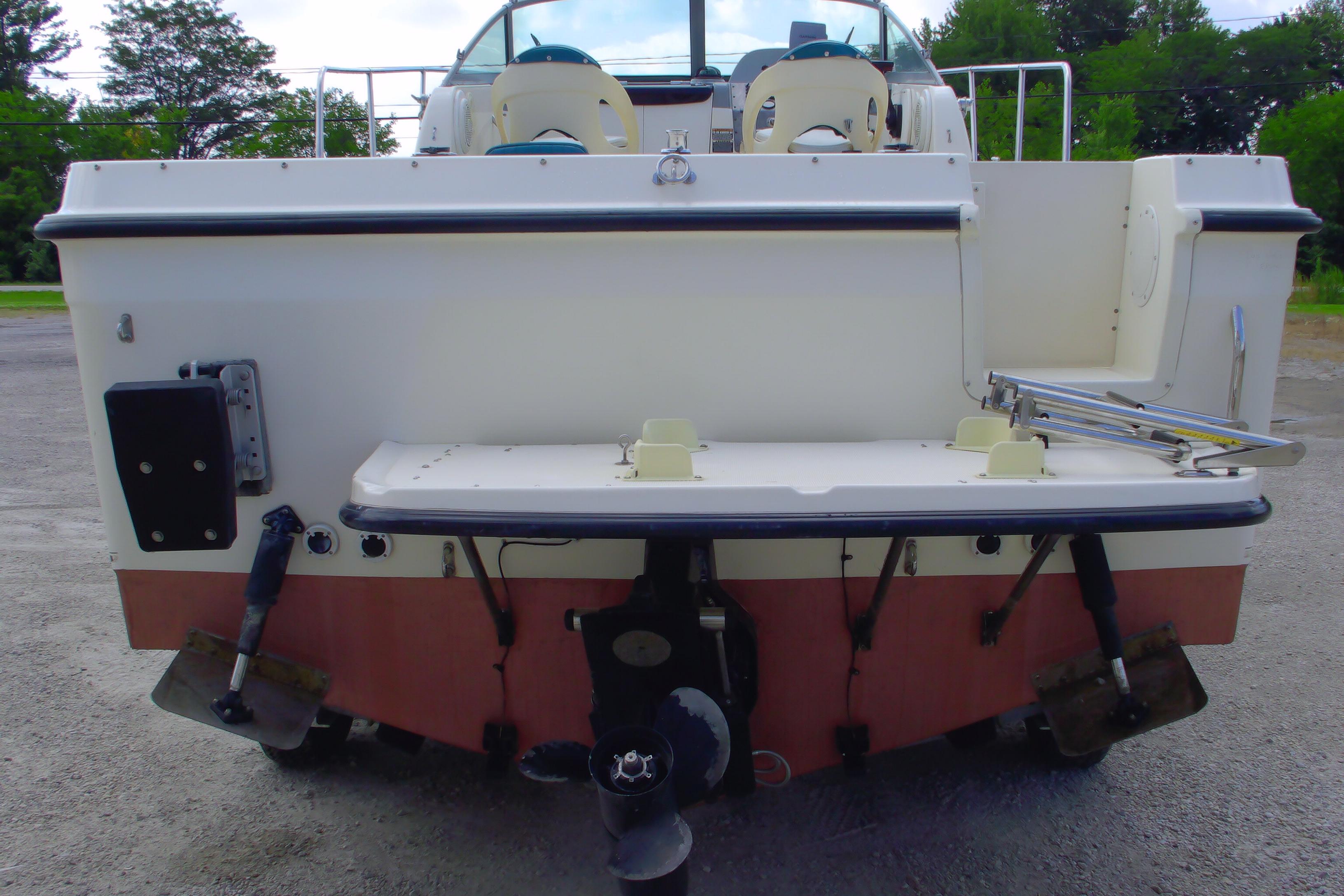 2004 Trophy 2352 Walkaround boat rear view with propeller and swim platform.