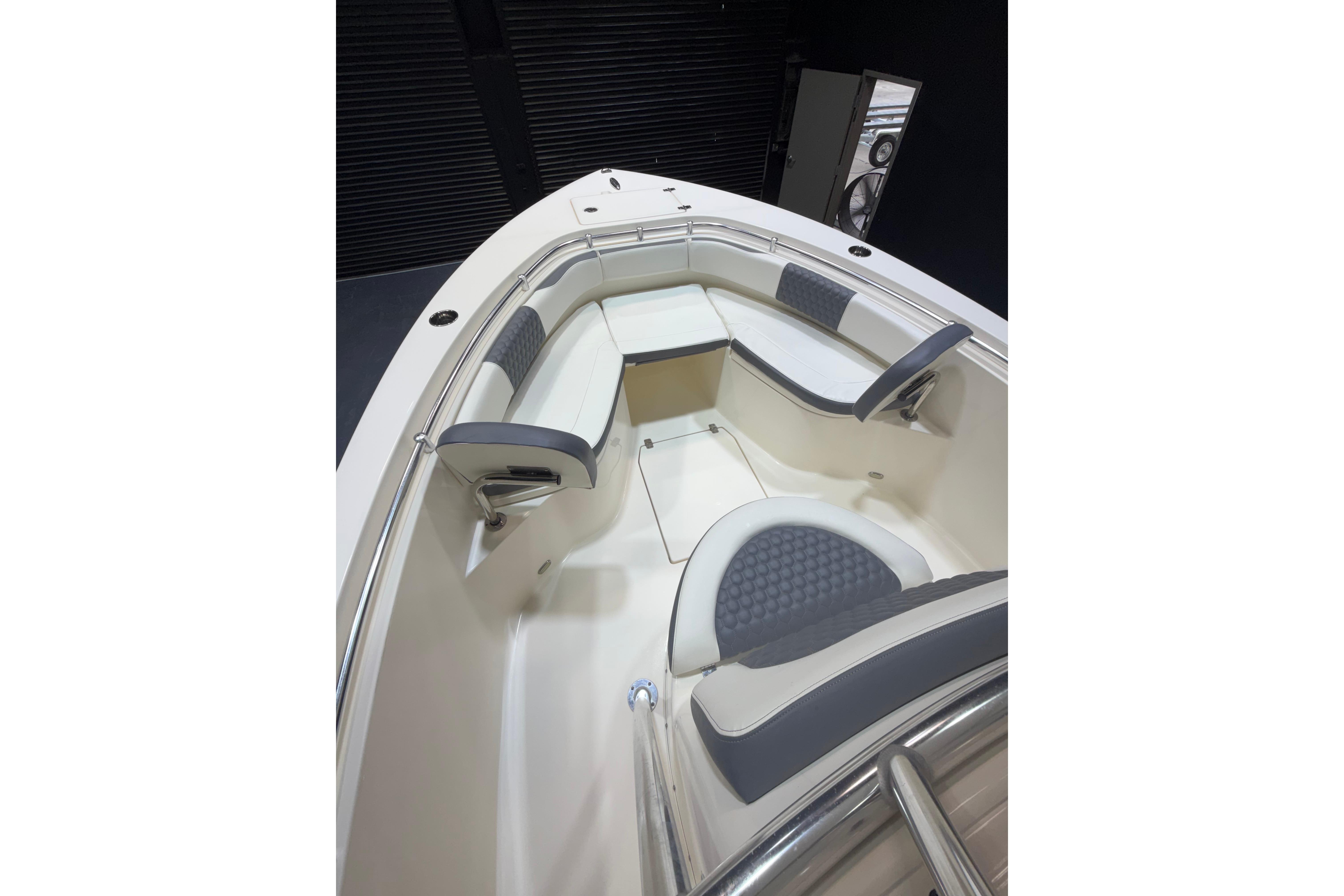 2023 Cobia 237 Center Console boat interior with cushioned seating and sleek design.