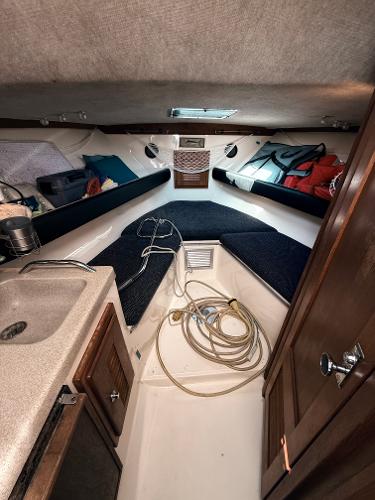2001 Albemarle 280 Express Sport Fisherman cabin interior with sink and storage.