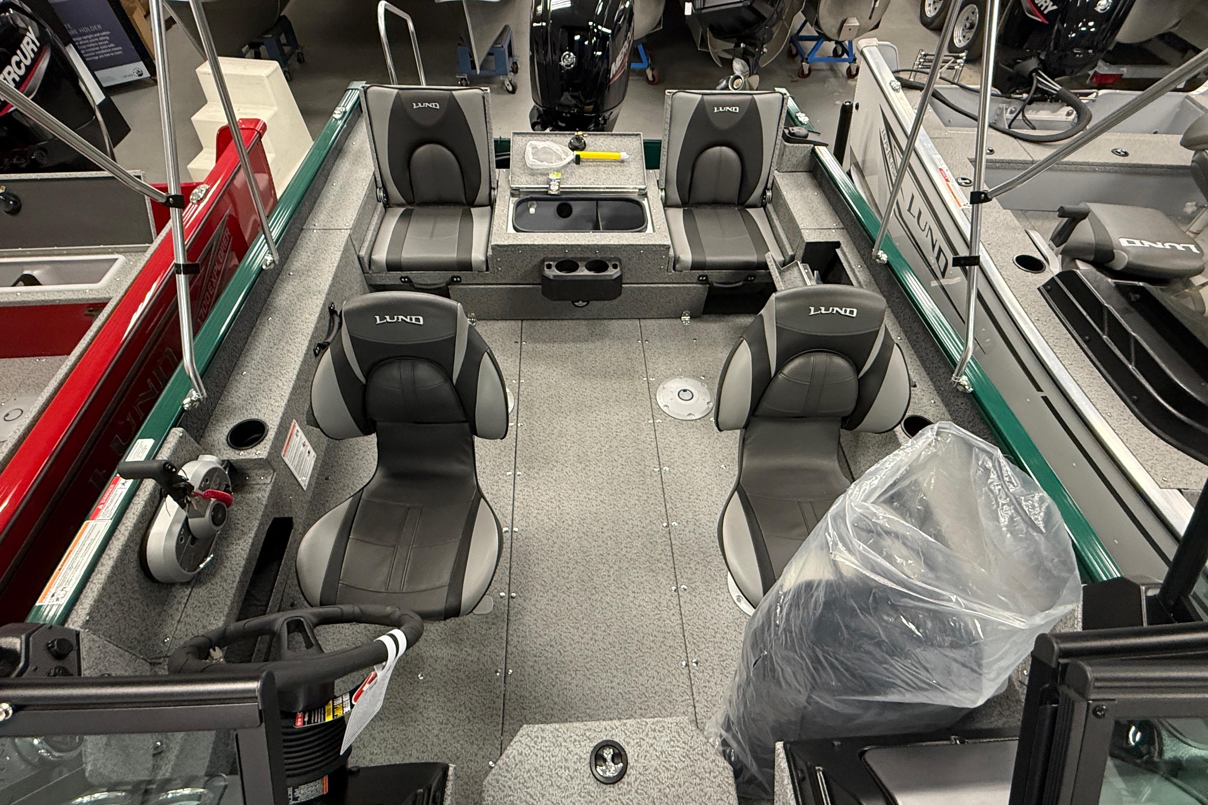 2026 Lund 1775 Adventure Sport boat interior with seating and steering wheel.