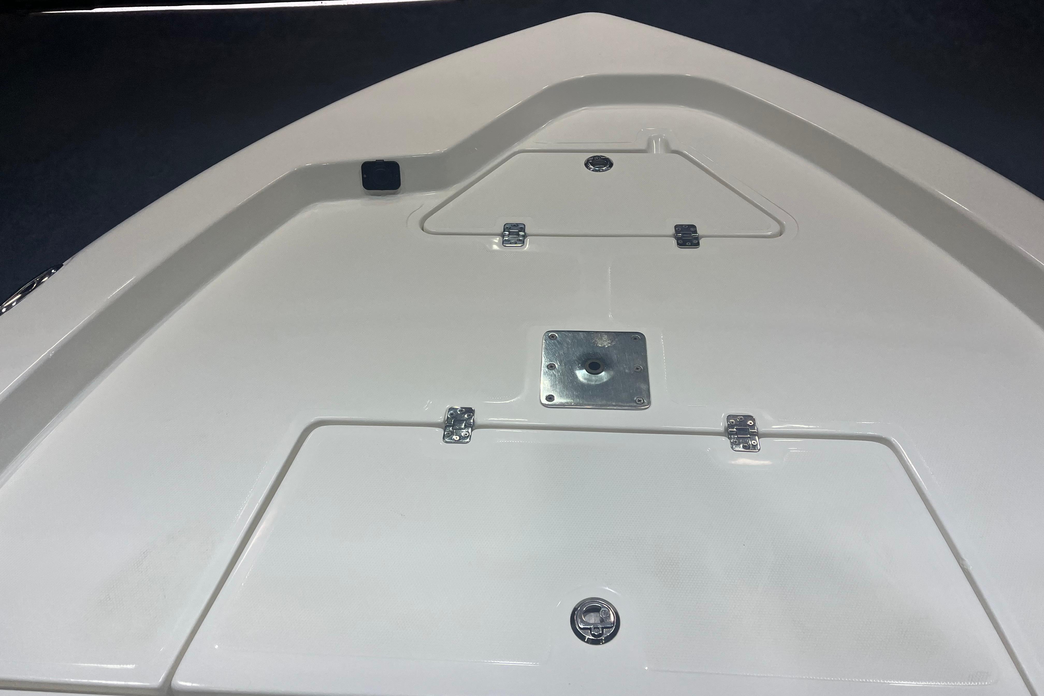 2023 NauticStar 227 XTS boat deck with storage compartments and mounting plate.