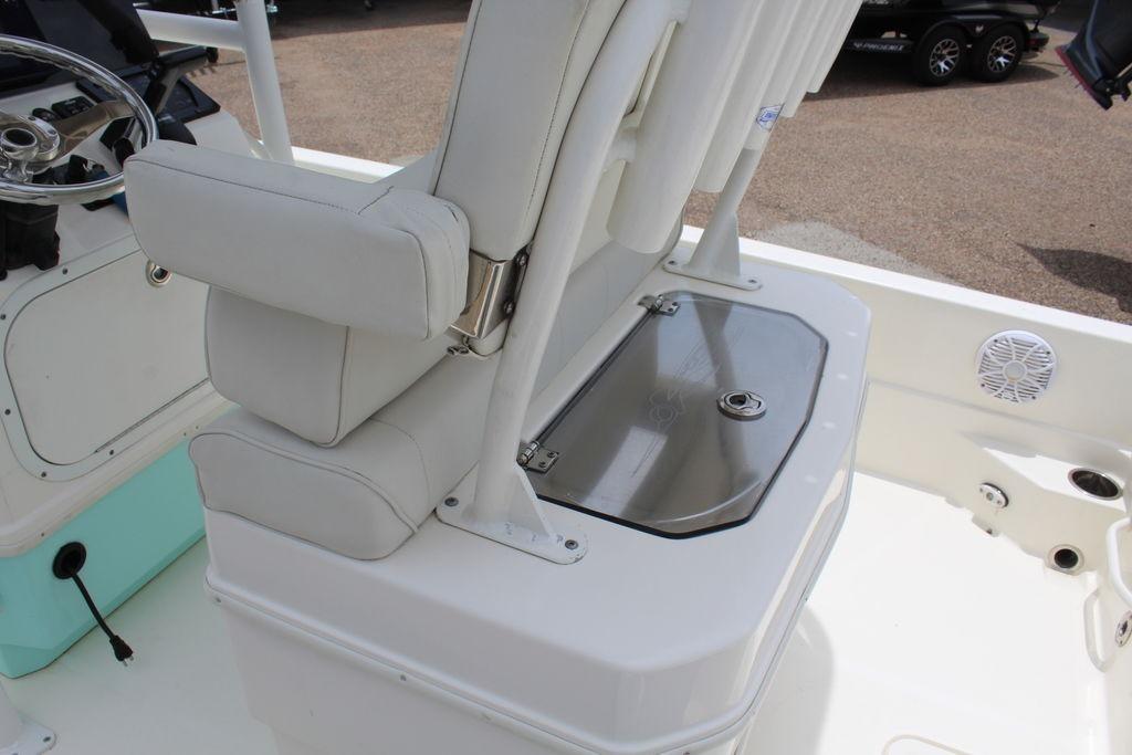 2026 Skeeter SX230 boat interior with white seating and storage compartment.