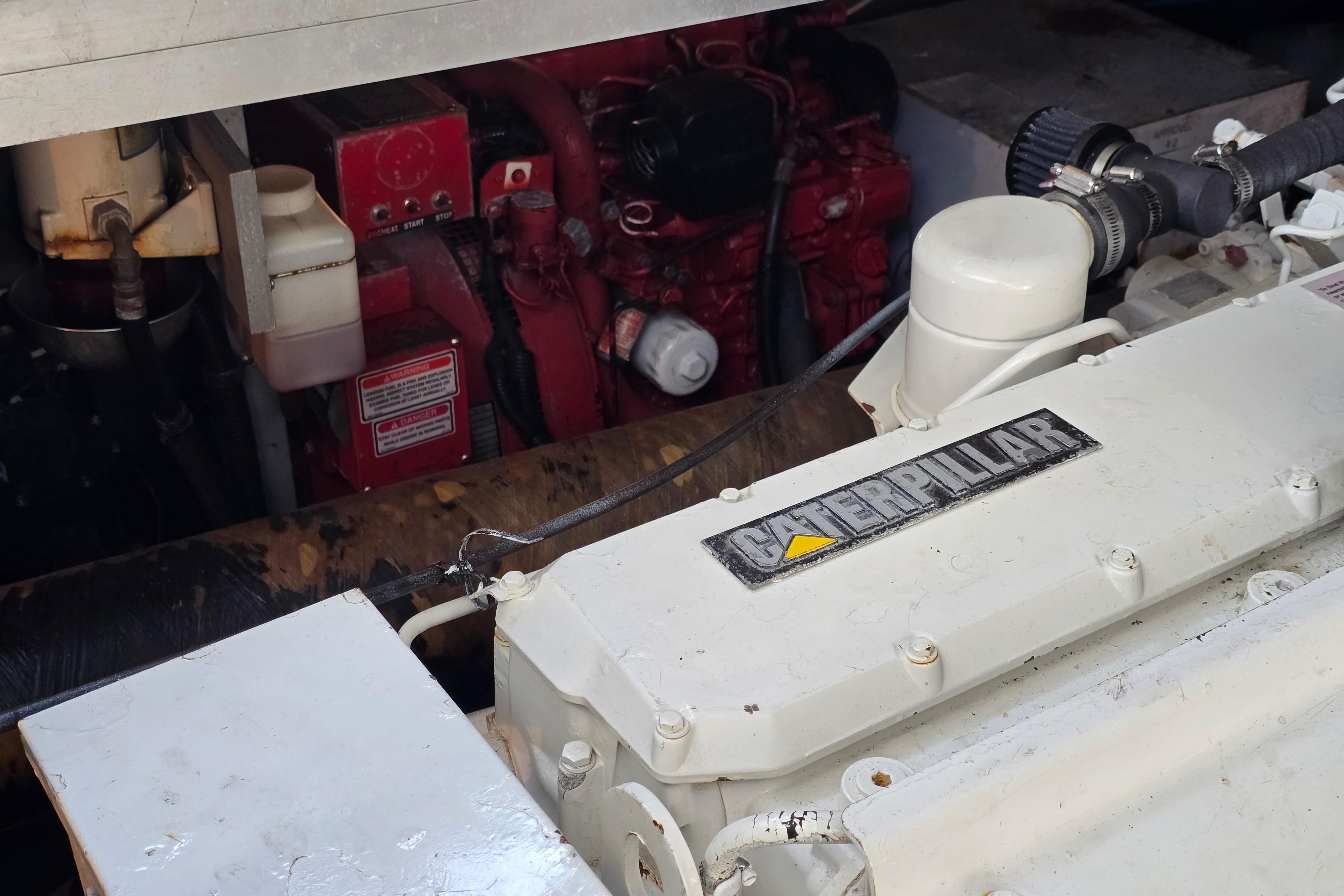 Engine compartment of a 1999 Sea Ray Sundancer 400 with Caterpillar components.
