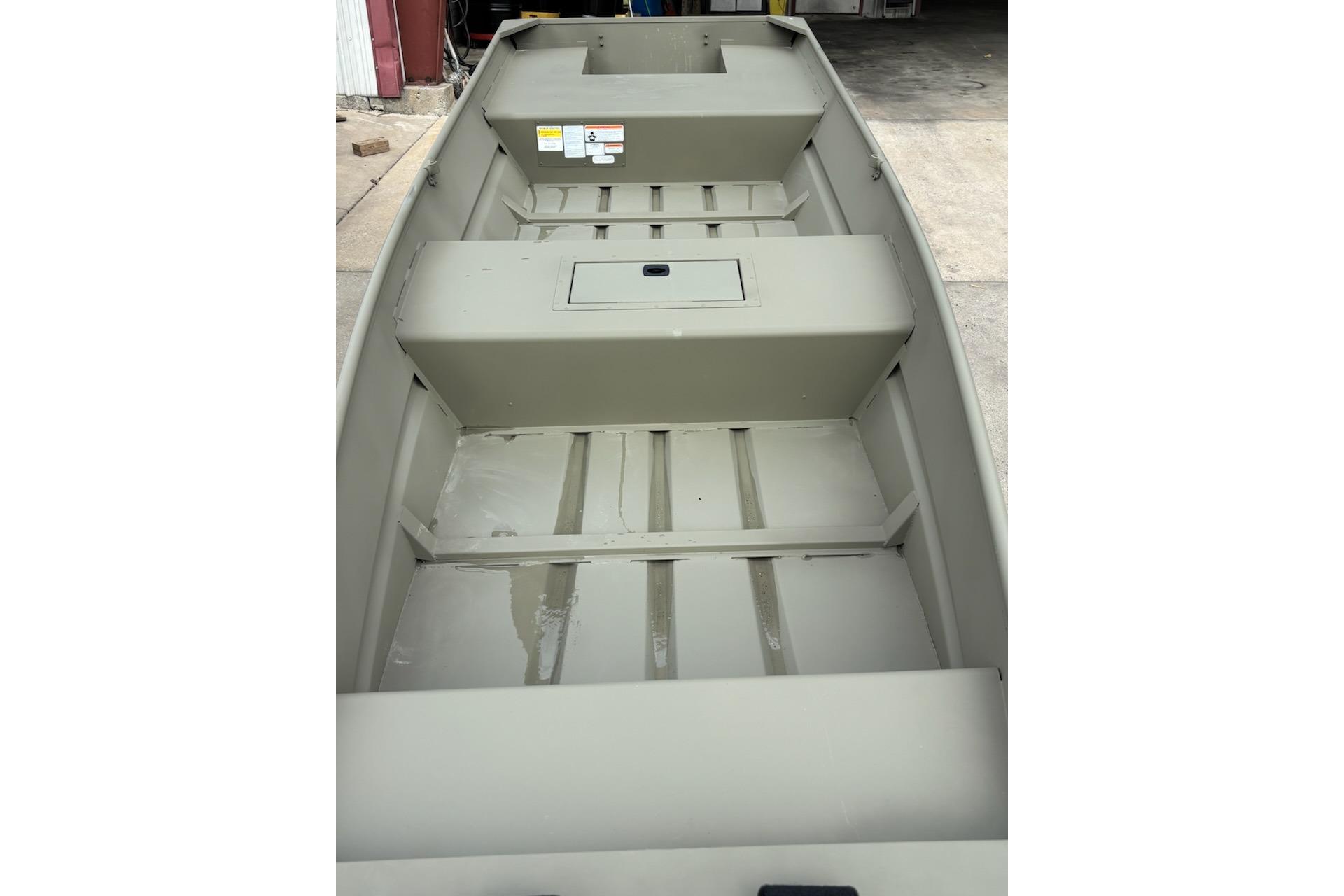 2026 Tracker Grizzly 12 Jon boat interior, featuring spacious seating and storage compartments.