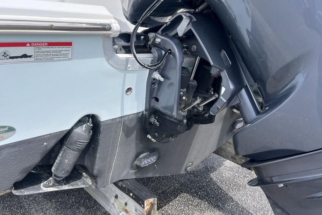 2021 Sea Hunt Gamefish 25 boat engine close-up, showing motor and mounting details.