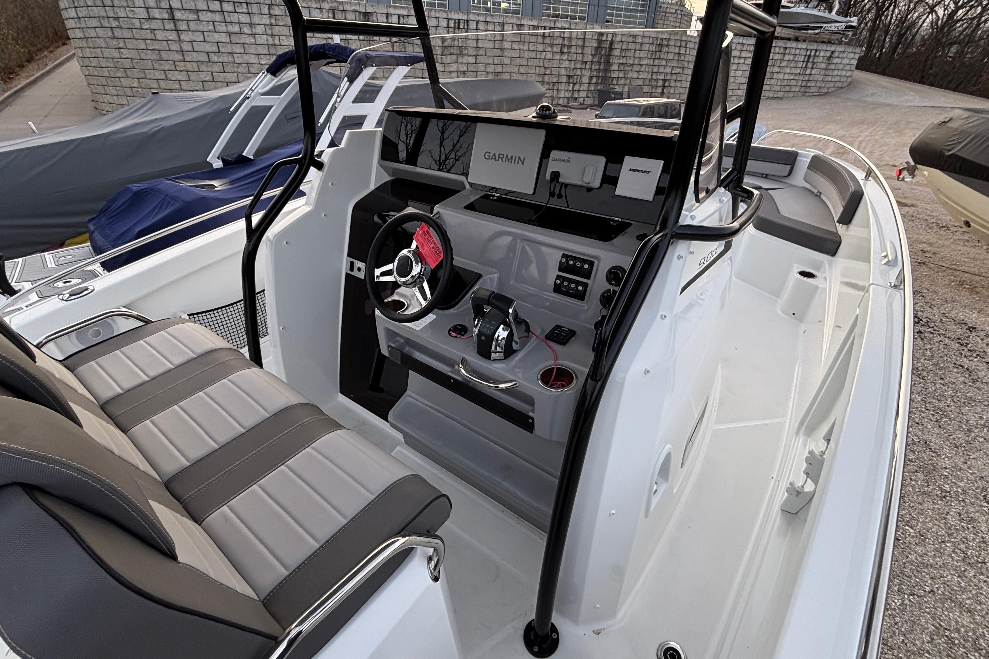 2022 Jeanneau Leader 9.0 CC boat interior with modern helm and seating.