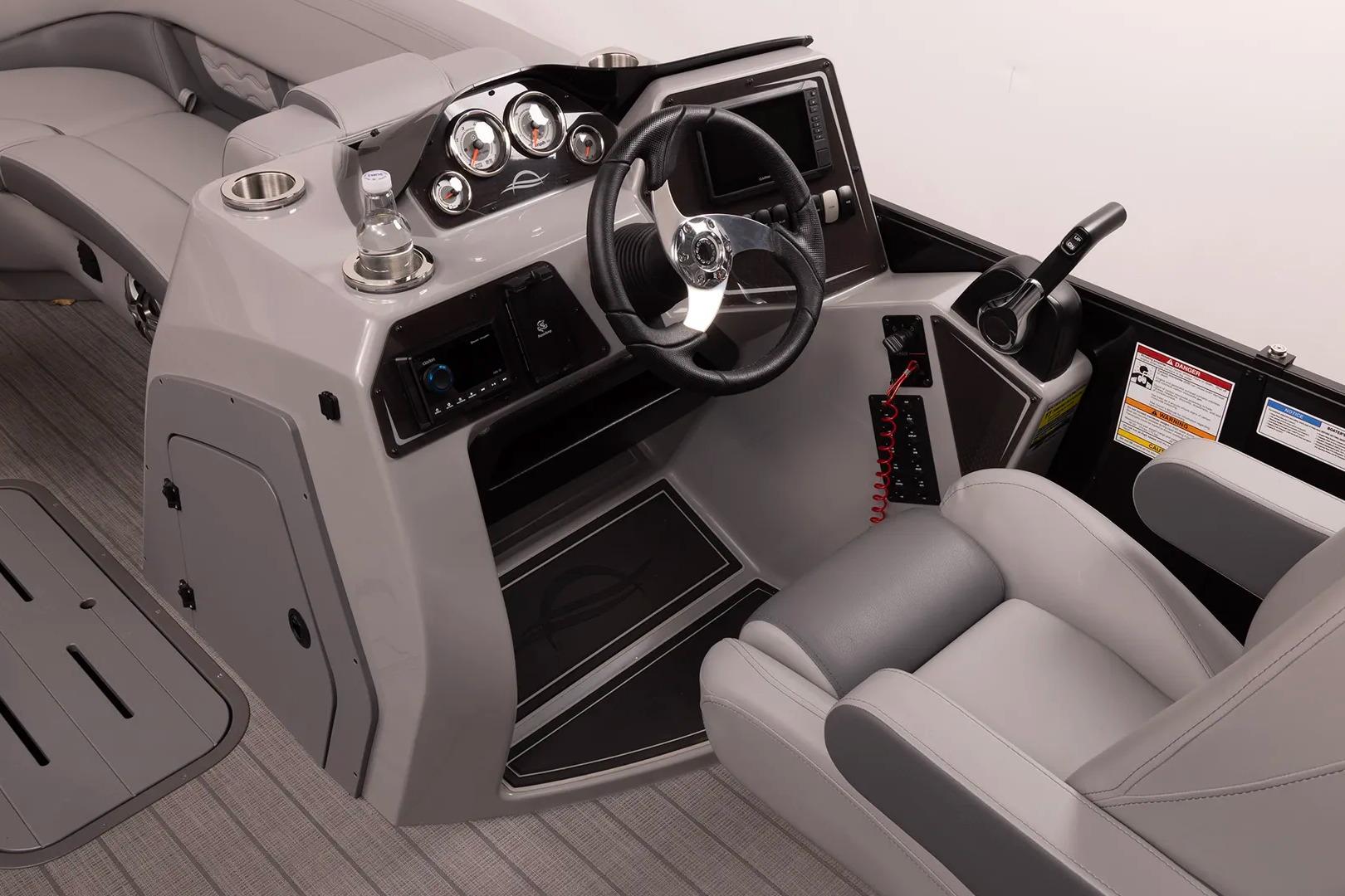 2026 SunCatcher Fusion 322SS boat cockpit with modern steering and controls.