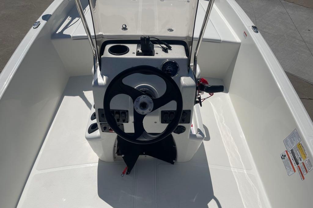 2026 Mako Pro Skiff 17 CC boat console with steering wheel and controls.