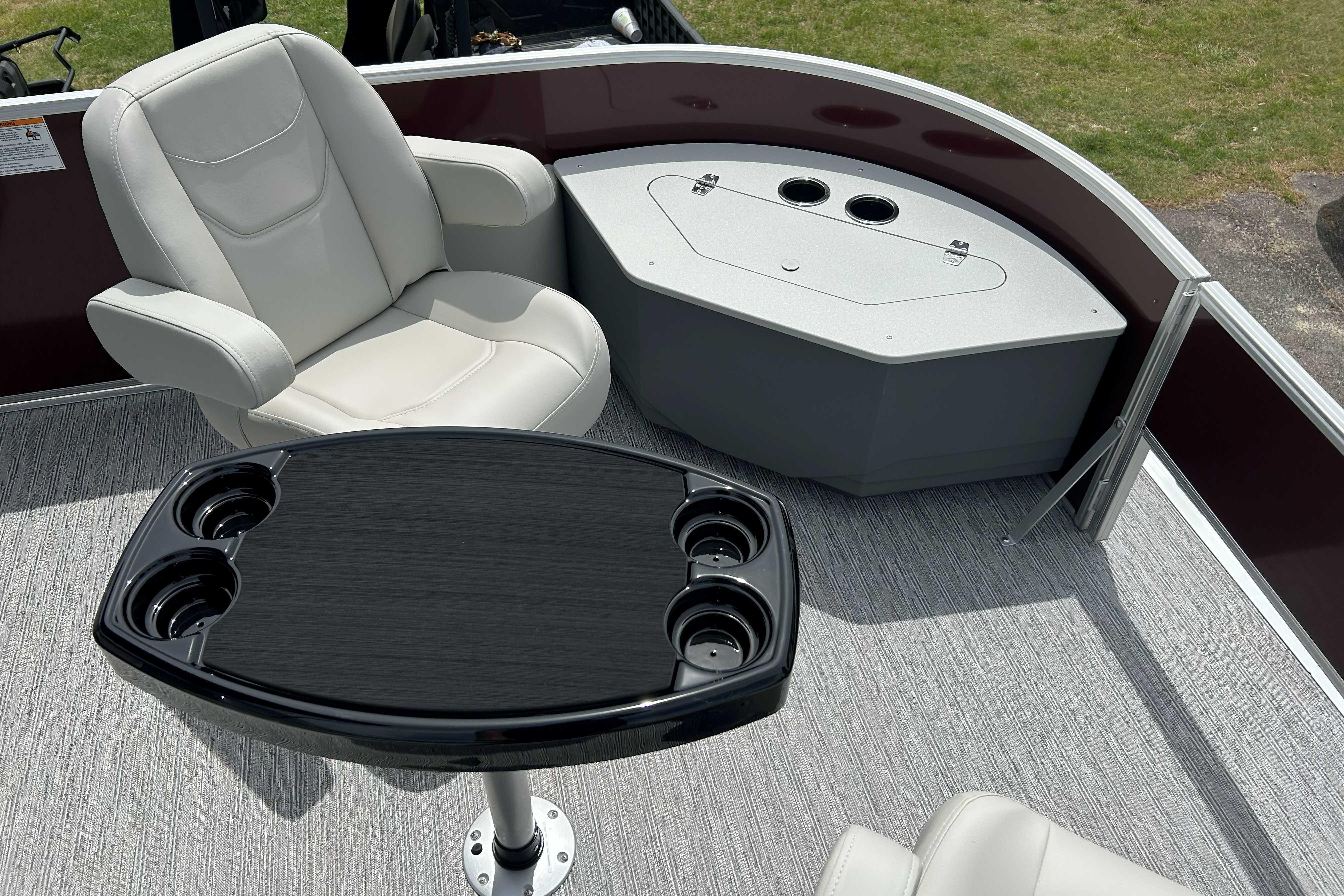 2026 Starcraft EX 20 F boat interior with comfortable seating and cup holders.
