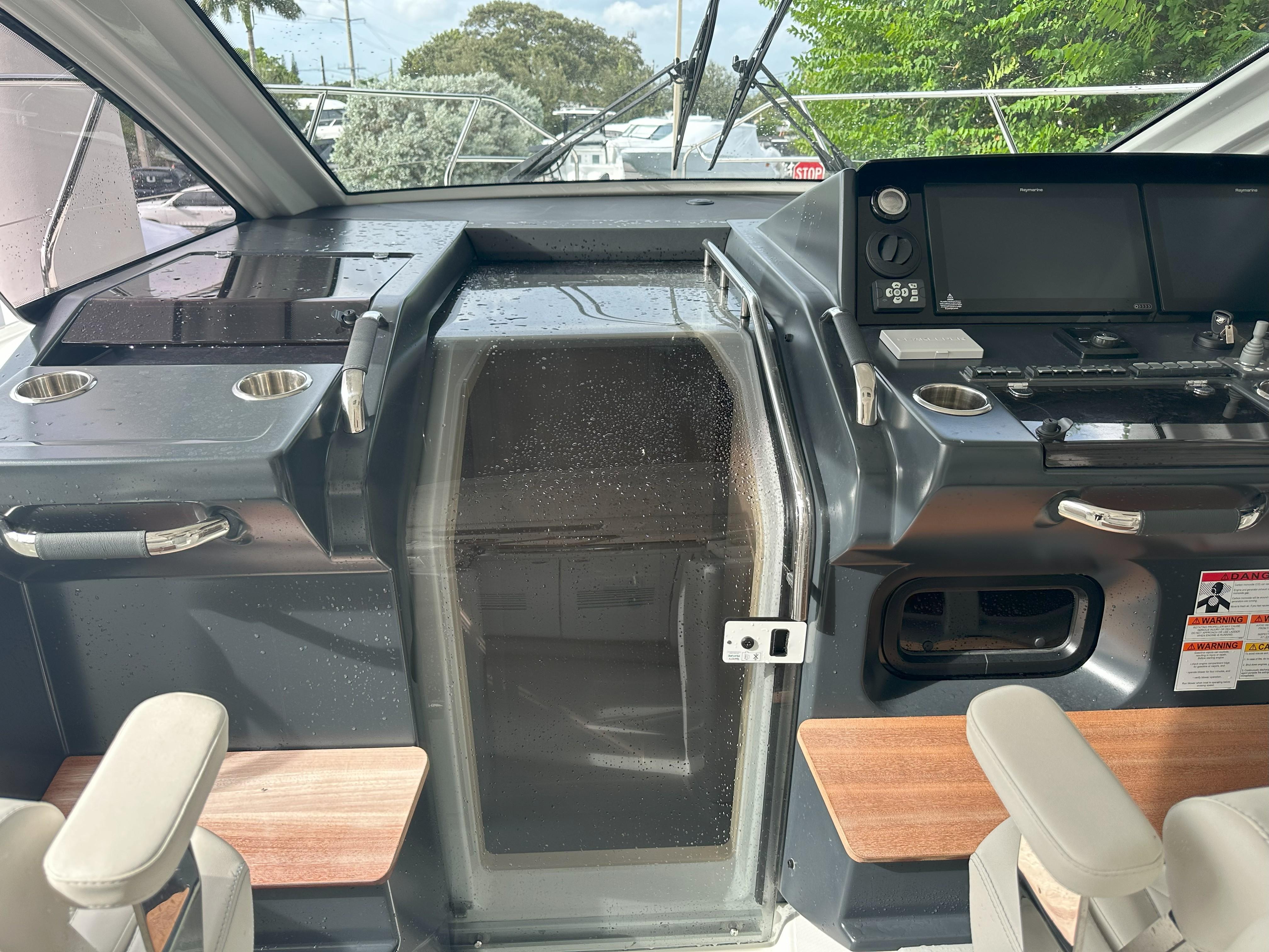 2024 Jeanneau DB 43 cockpit with modern controls and seating, showcasing sleek design.