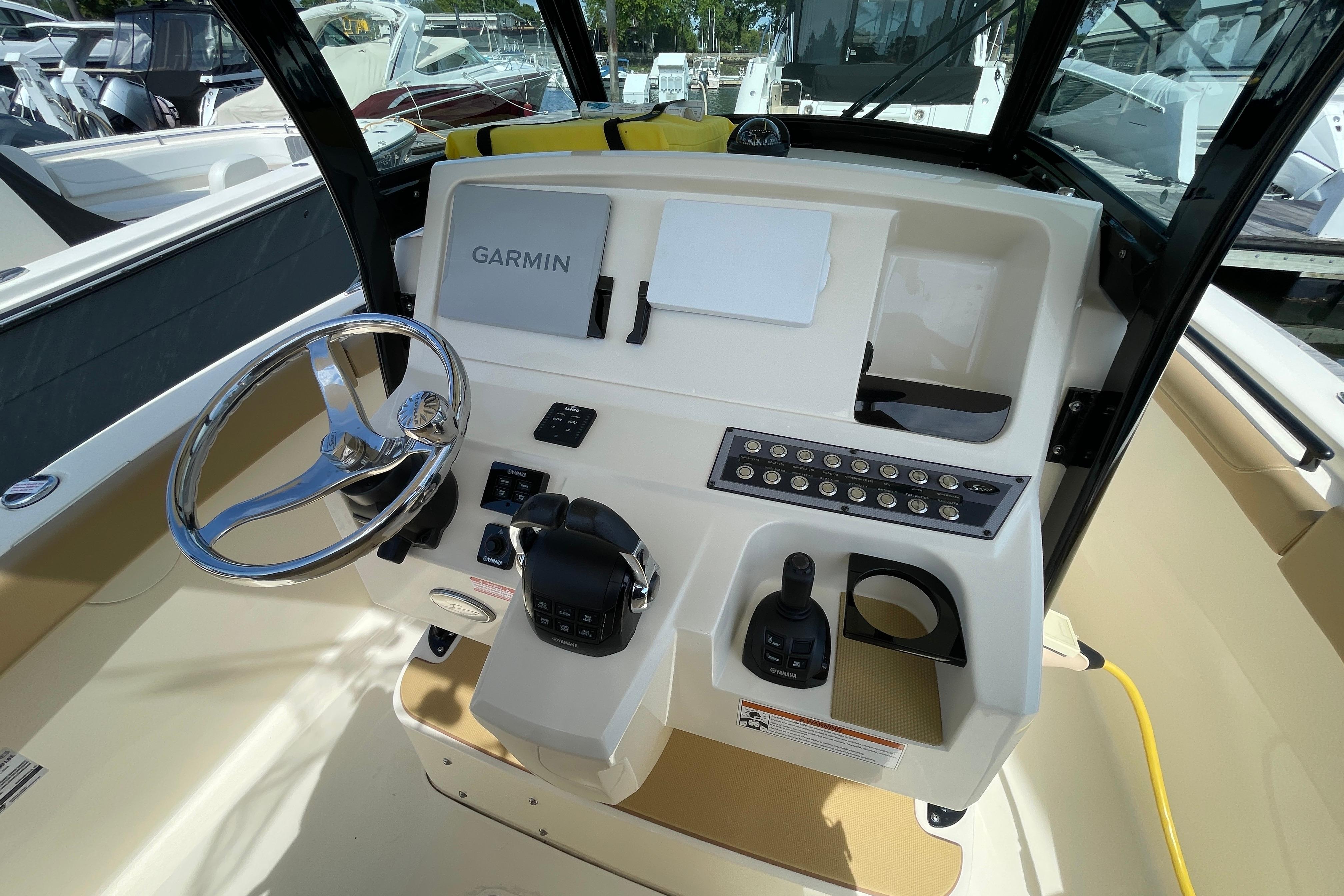 2020 Scout 255 LXF boat dashboard with Garmin navigation system and steering wheel.