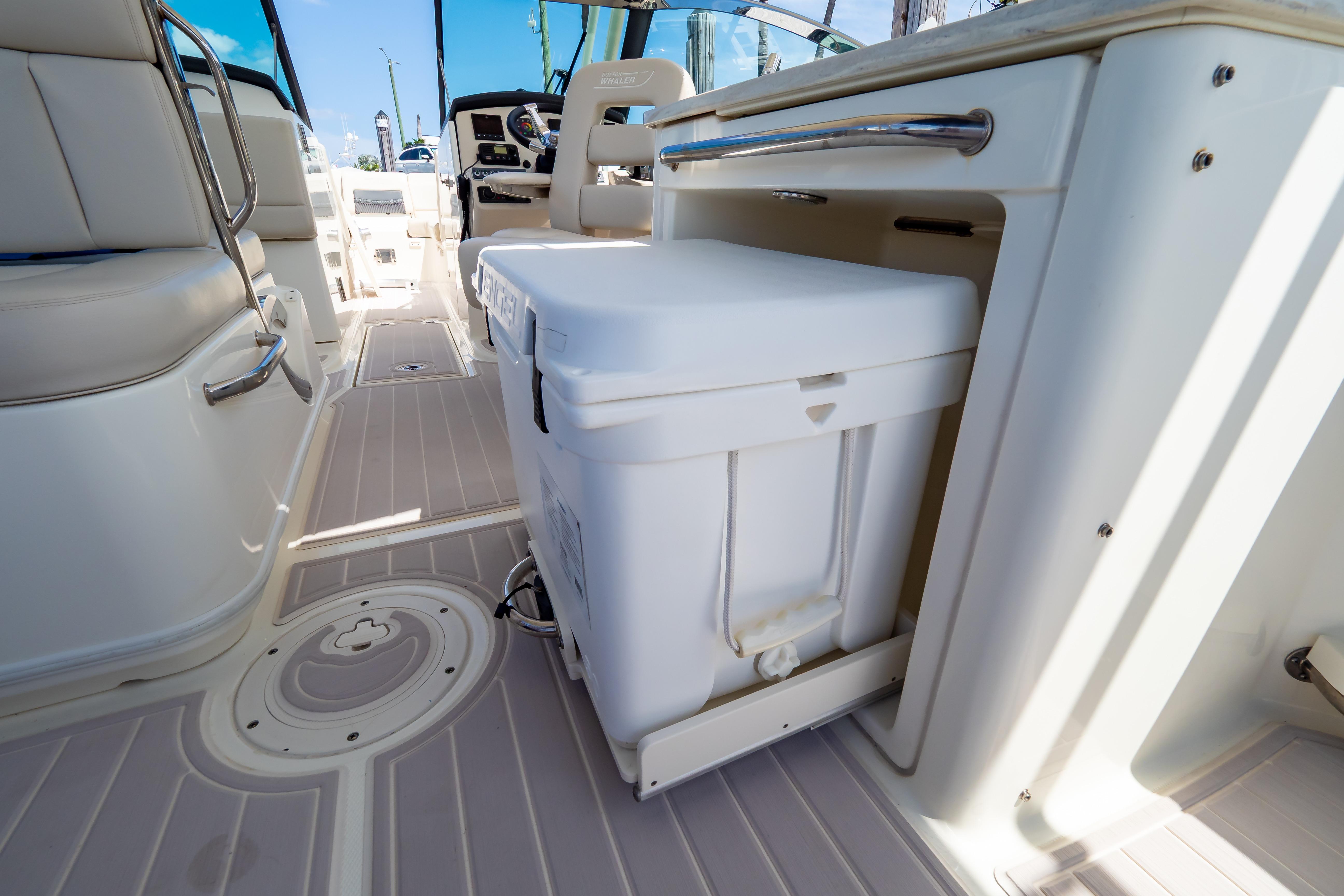 Interior of 2019 Boston Whaler 270 Vantage boat with seating and storage.