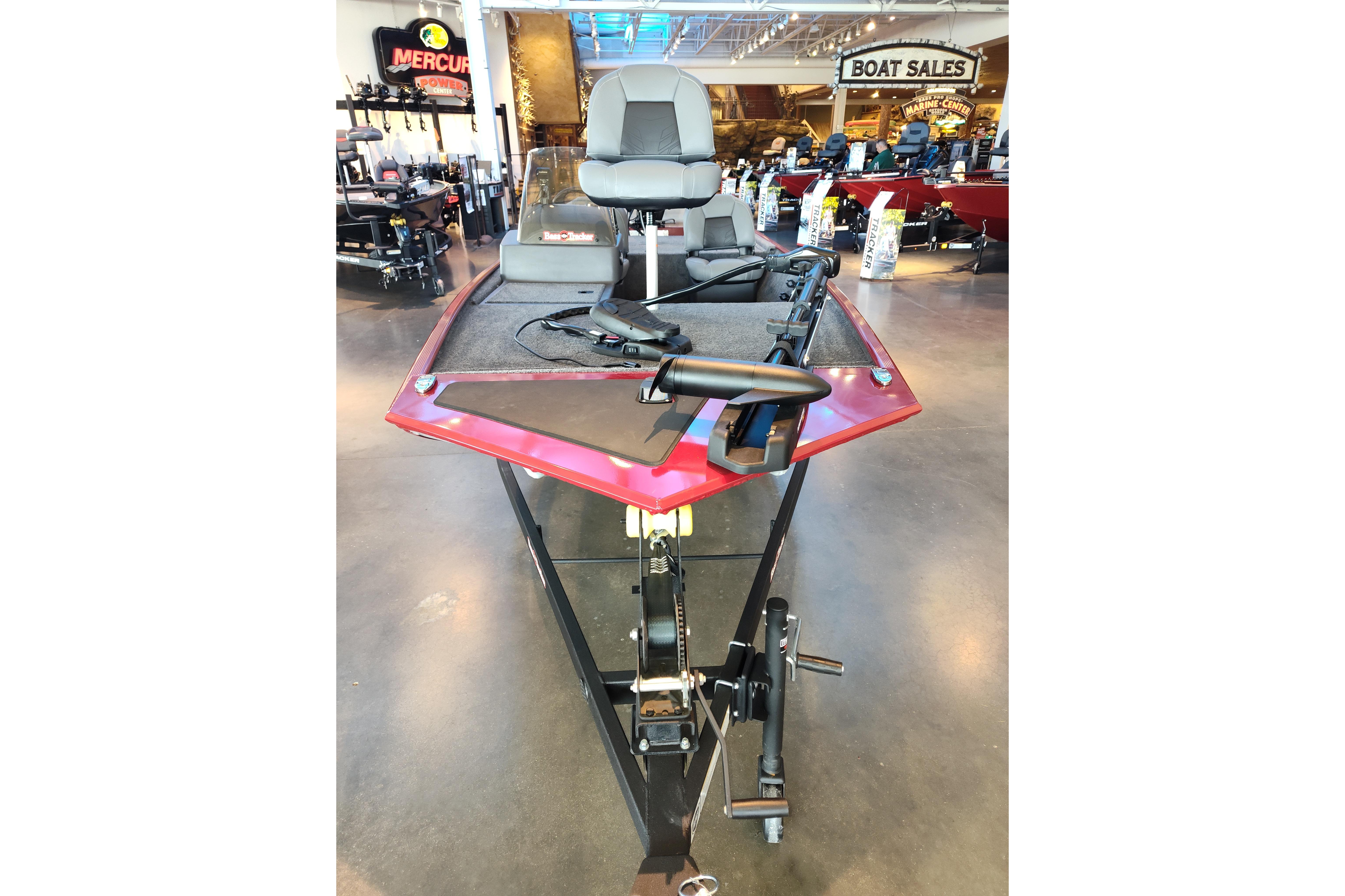 2026 Tracker Bass Tracker Classic XL boat displayed in showroom with fishing equipment.