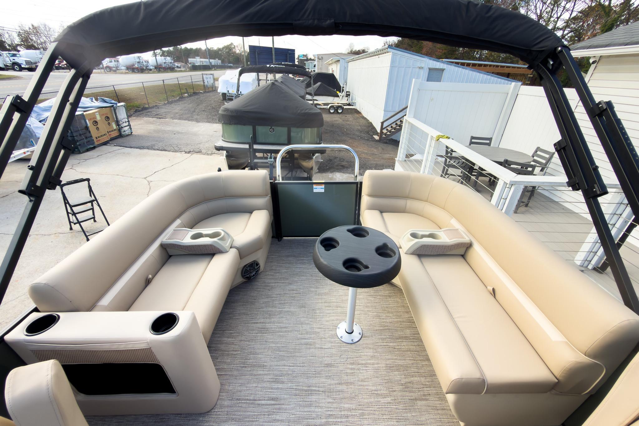 2026 Godfrey Sweetwater Xperience 22' Split Bench Pontoon with beige seating and cup holders.