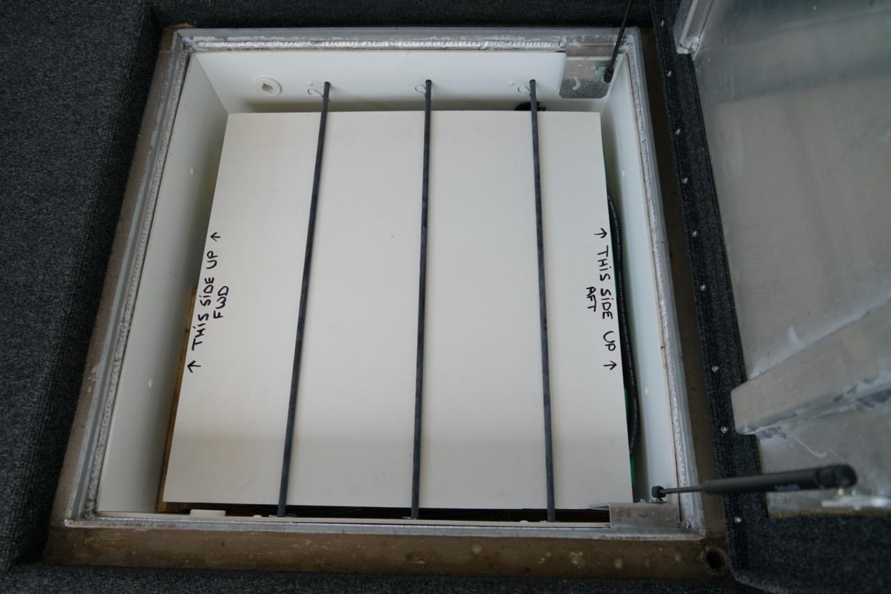 Hatch opening on 2000 Stardust Cruisers 83'x17' houseboat, showing interior compartment.