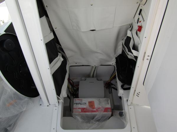 Interior storage compartment of 2025 Wellcraft 243 Fisherman boat.