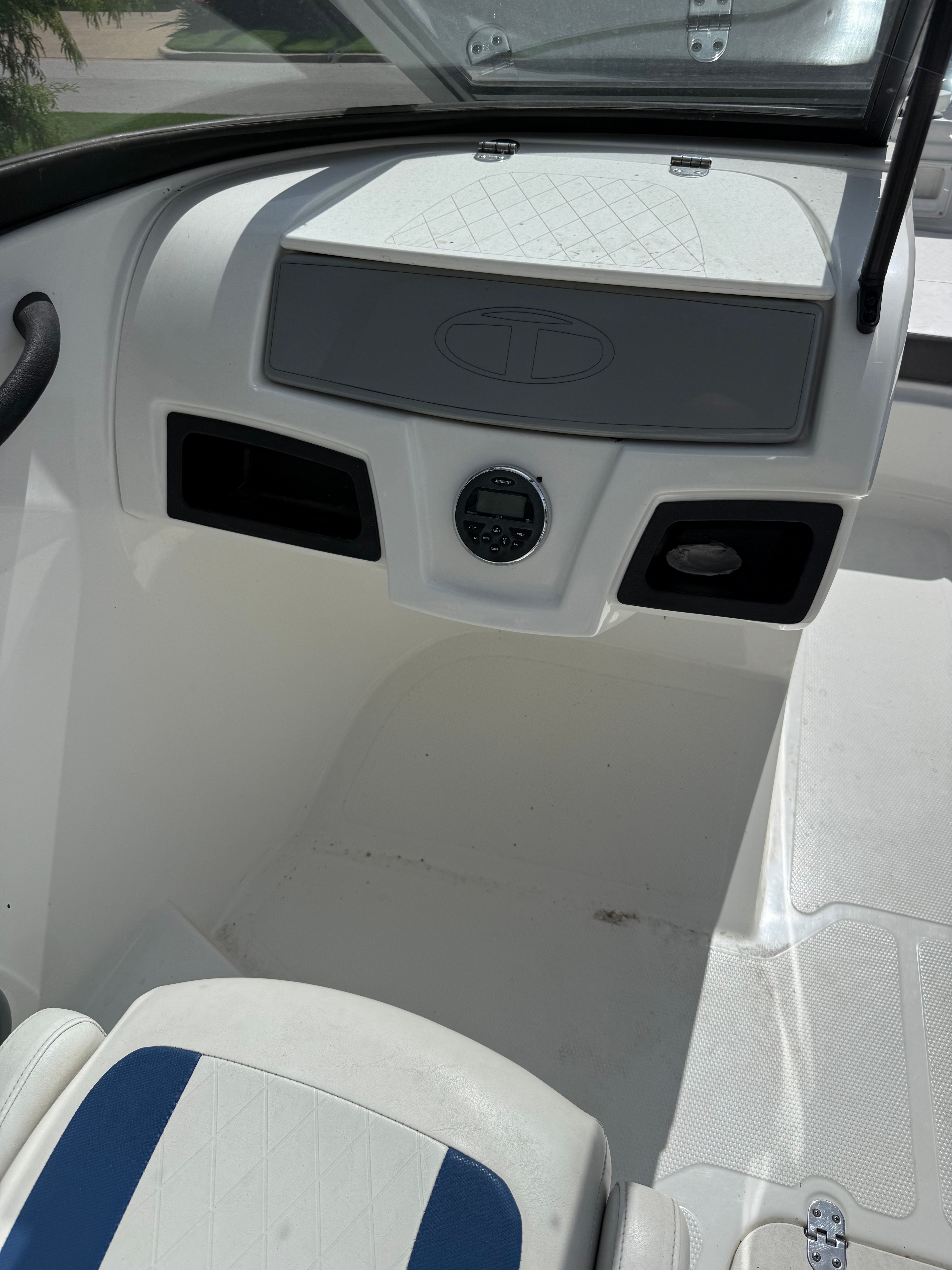 The image shows the cockpit of a 2019 Tahoe 450 TF boat with a helm console.