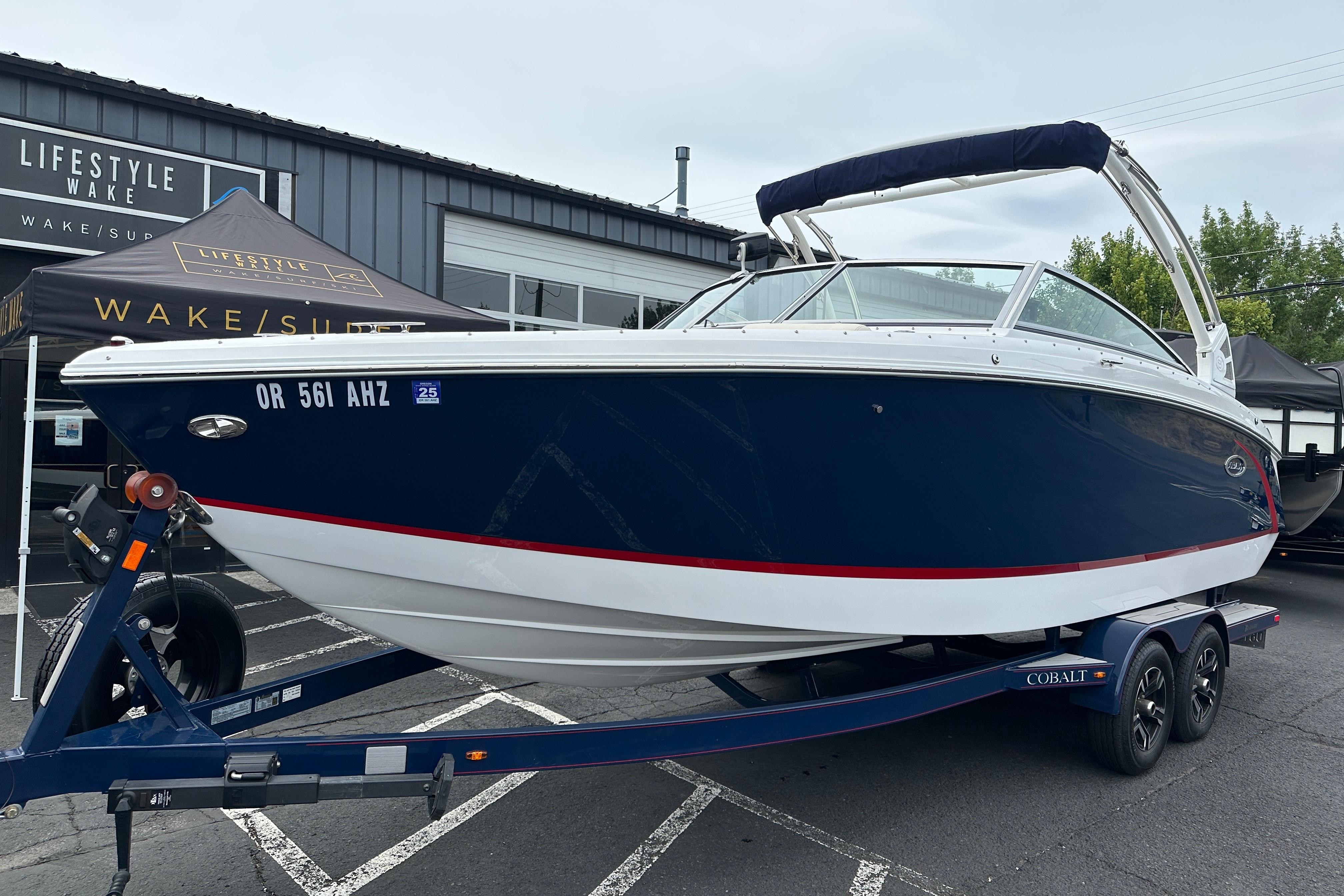 2019 Cobalt R5 boat on trailer, parked outside Lifestyle Wake store.