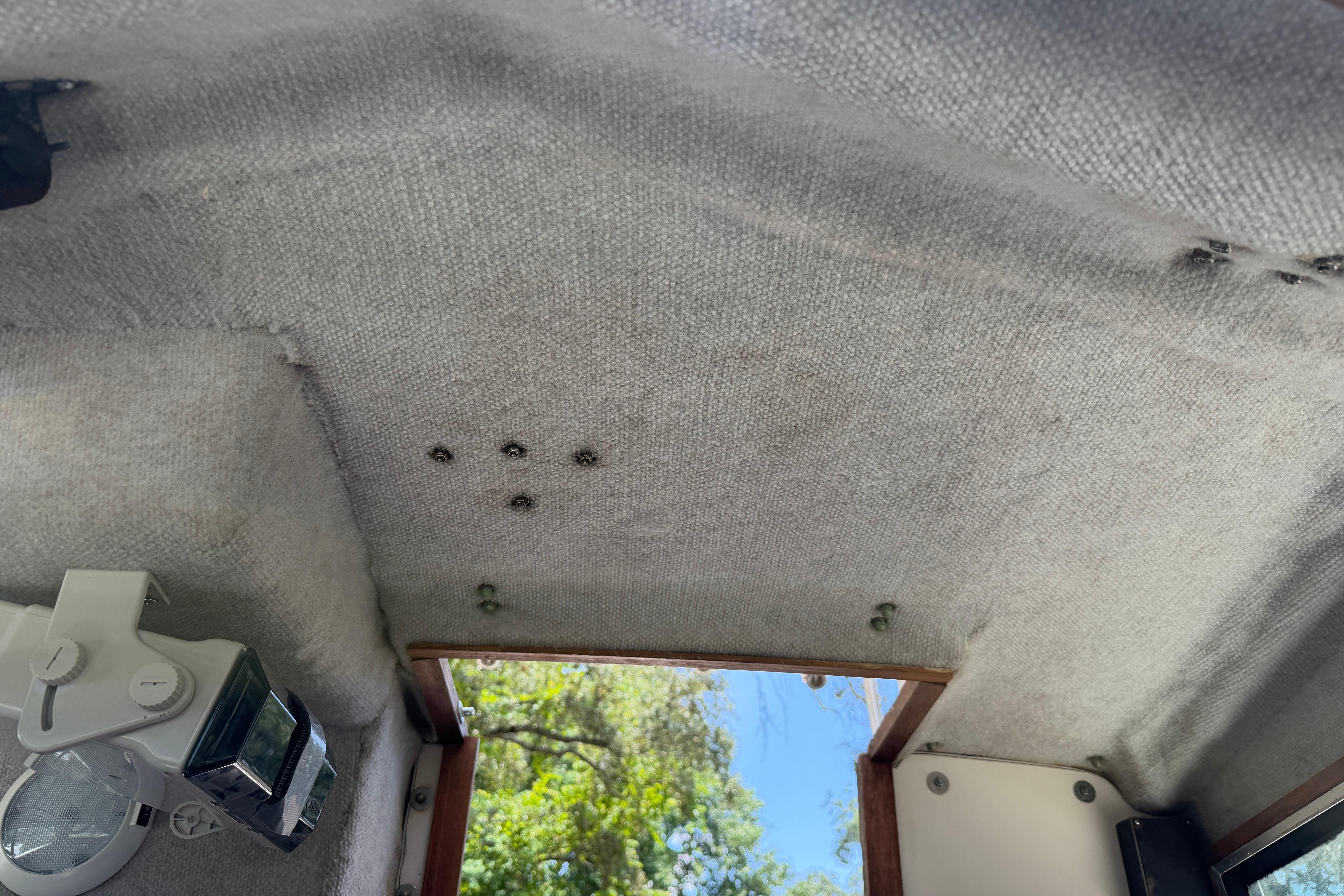 Interior ceiling of a 1987 Grady-White Seafarer 226 boat, showing light fixture and textured surface.