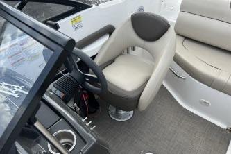2017 Bayliner 195 Deck Boat interior with steering wheel and seating area.