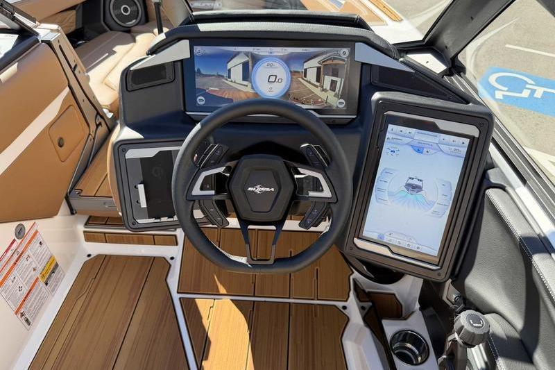 2026 Supra SL boat dashboard with advanced digital displays and modern steering wheel design.