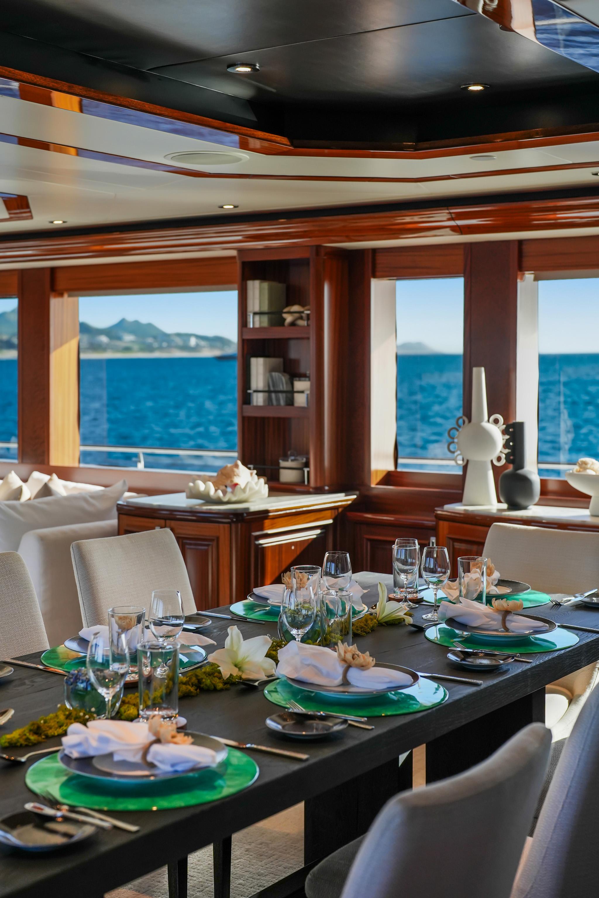 Luxurious dining area on 2011 Westport 40-meter yacht with ocean view.