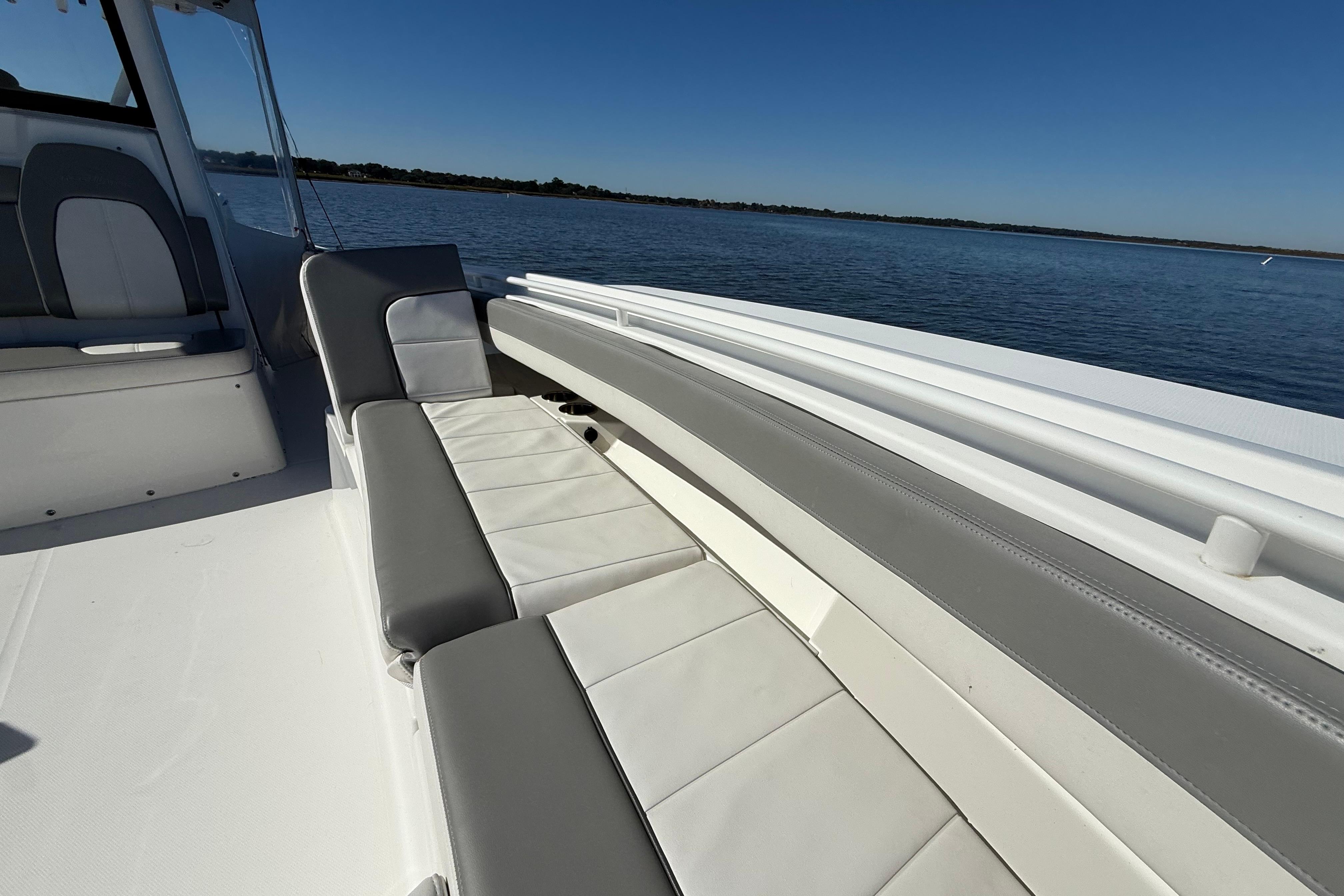 2022 Regulator 34 boat interior with cushioned seating, overlooking calm waters.