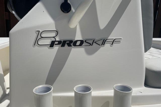 2026 Mako 18 Pro Skiff boat console with rod holders and logo.